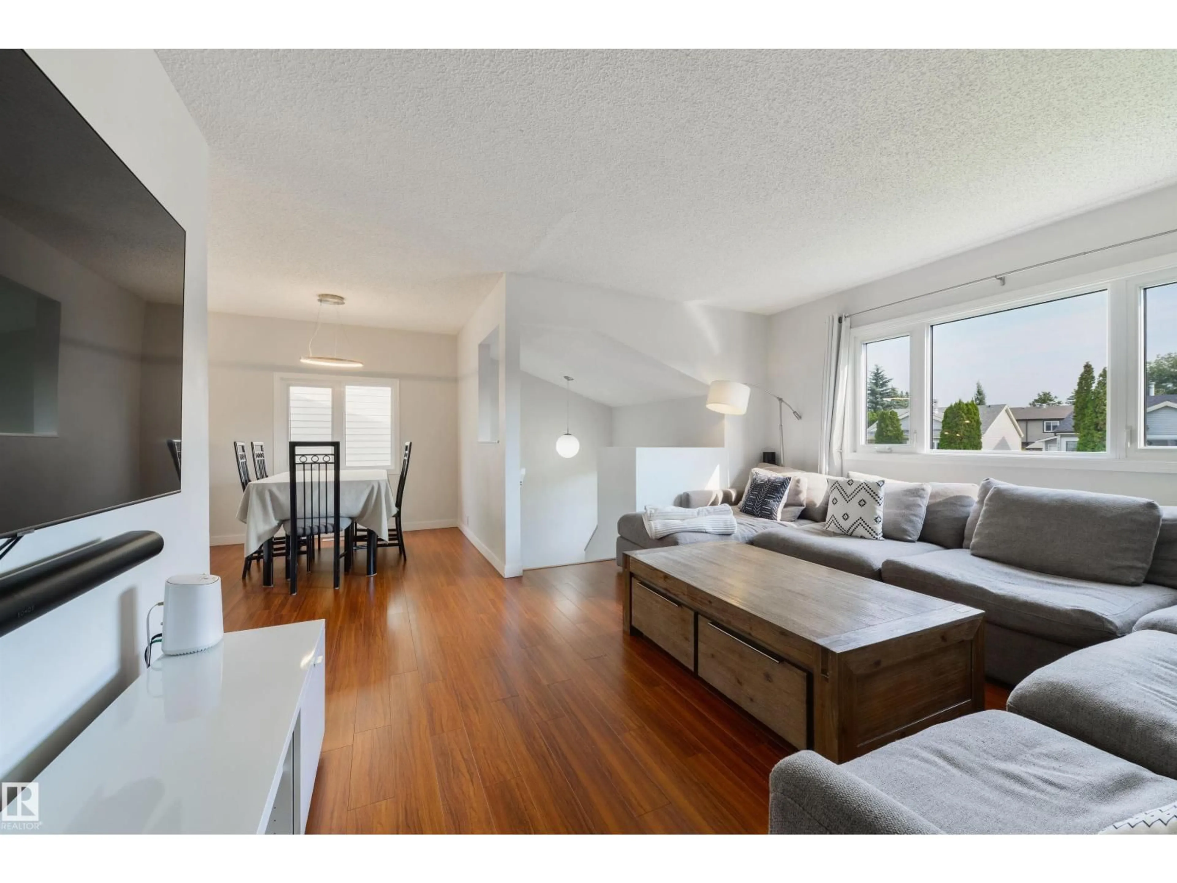 Living room with furniture, wood/laminate floor for 18423 96A AV, Edmonton Alberta T5T3N8