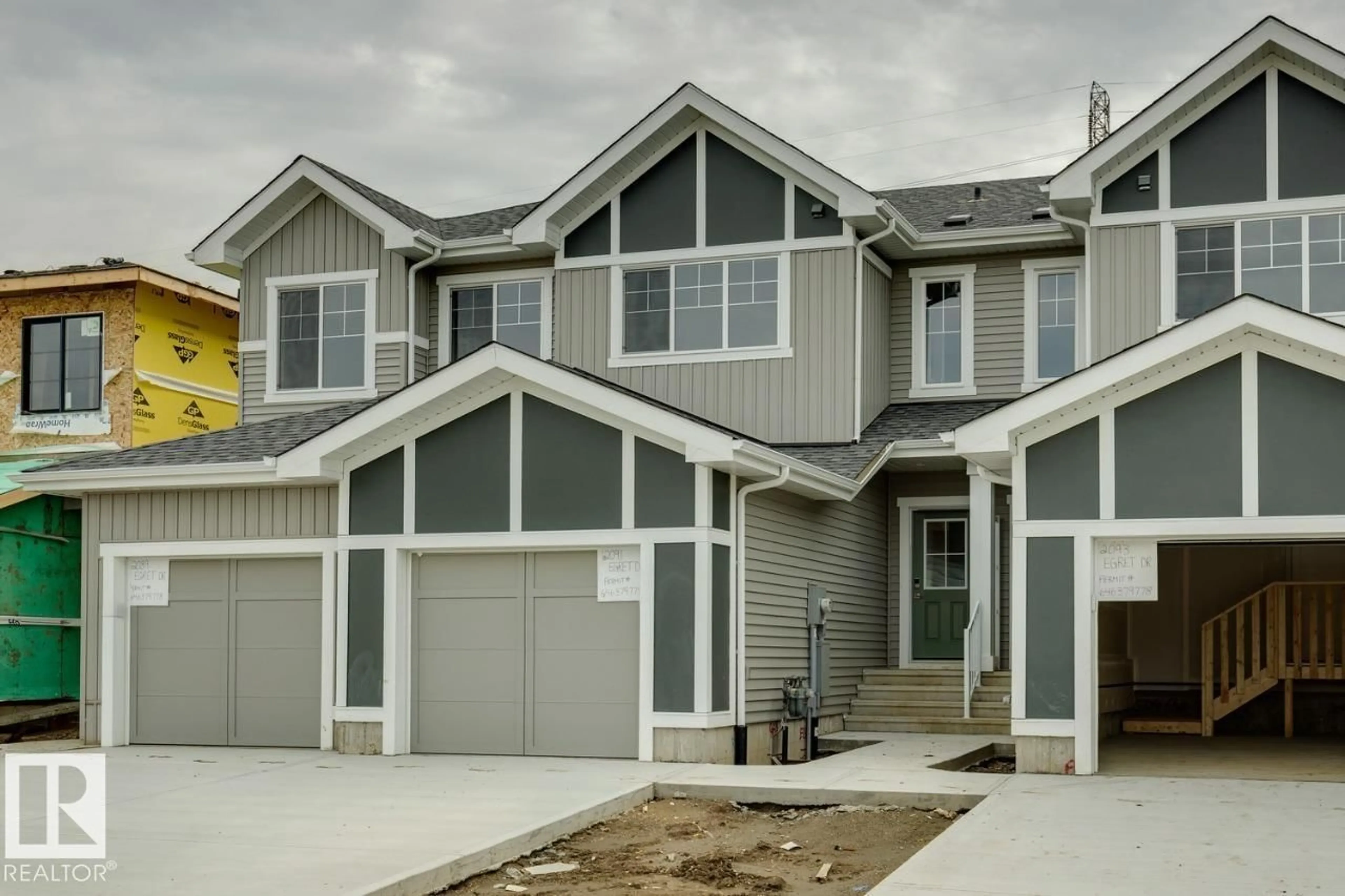 Home with vinyl exterior material, street for 2091 EGRET DR, Edmonton Alberta T6M3G7