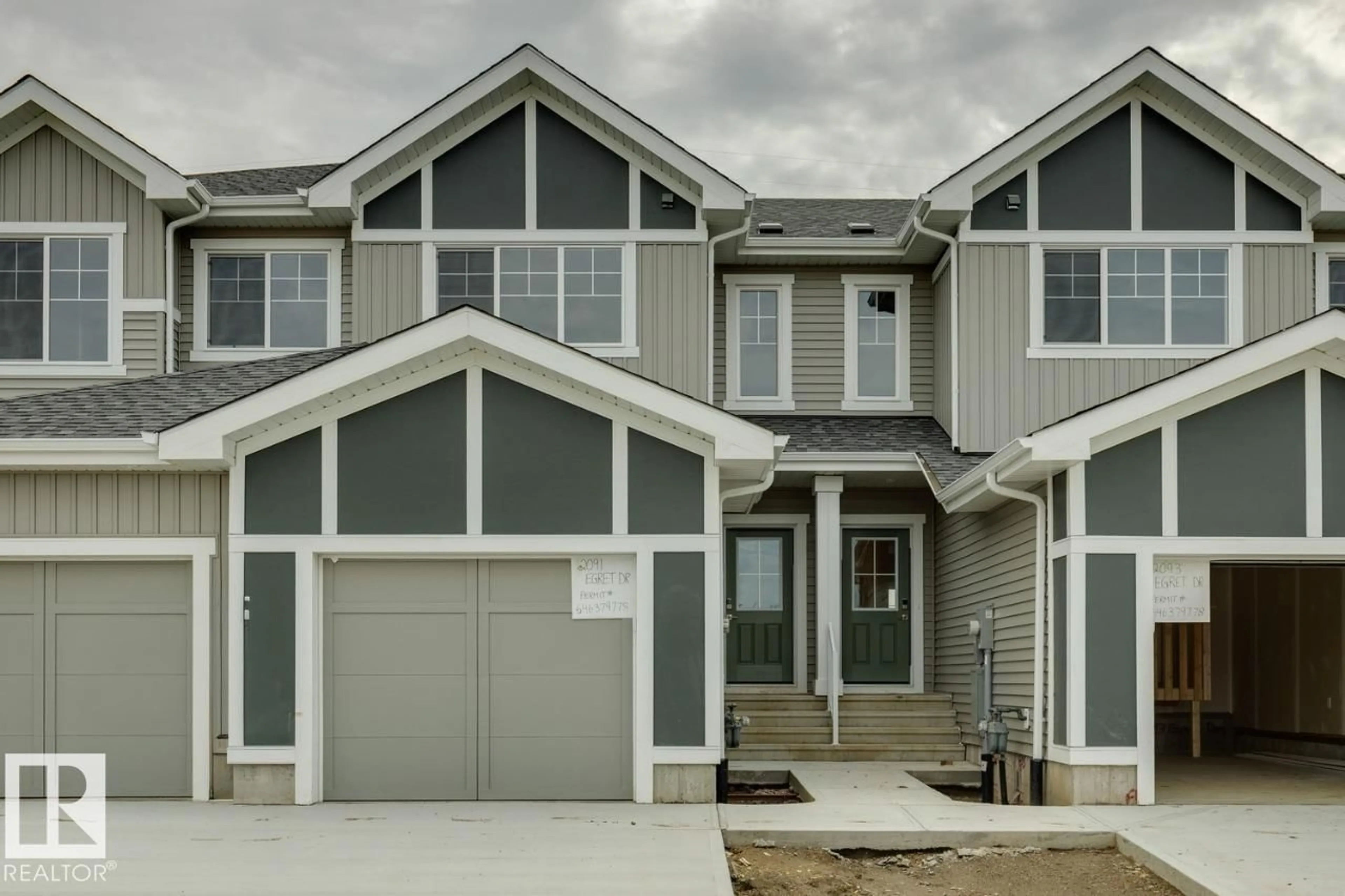 Home with vinyl exterior material, street for 2091 EGRET DR, Edmonton Alberta T6M3G7