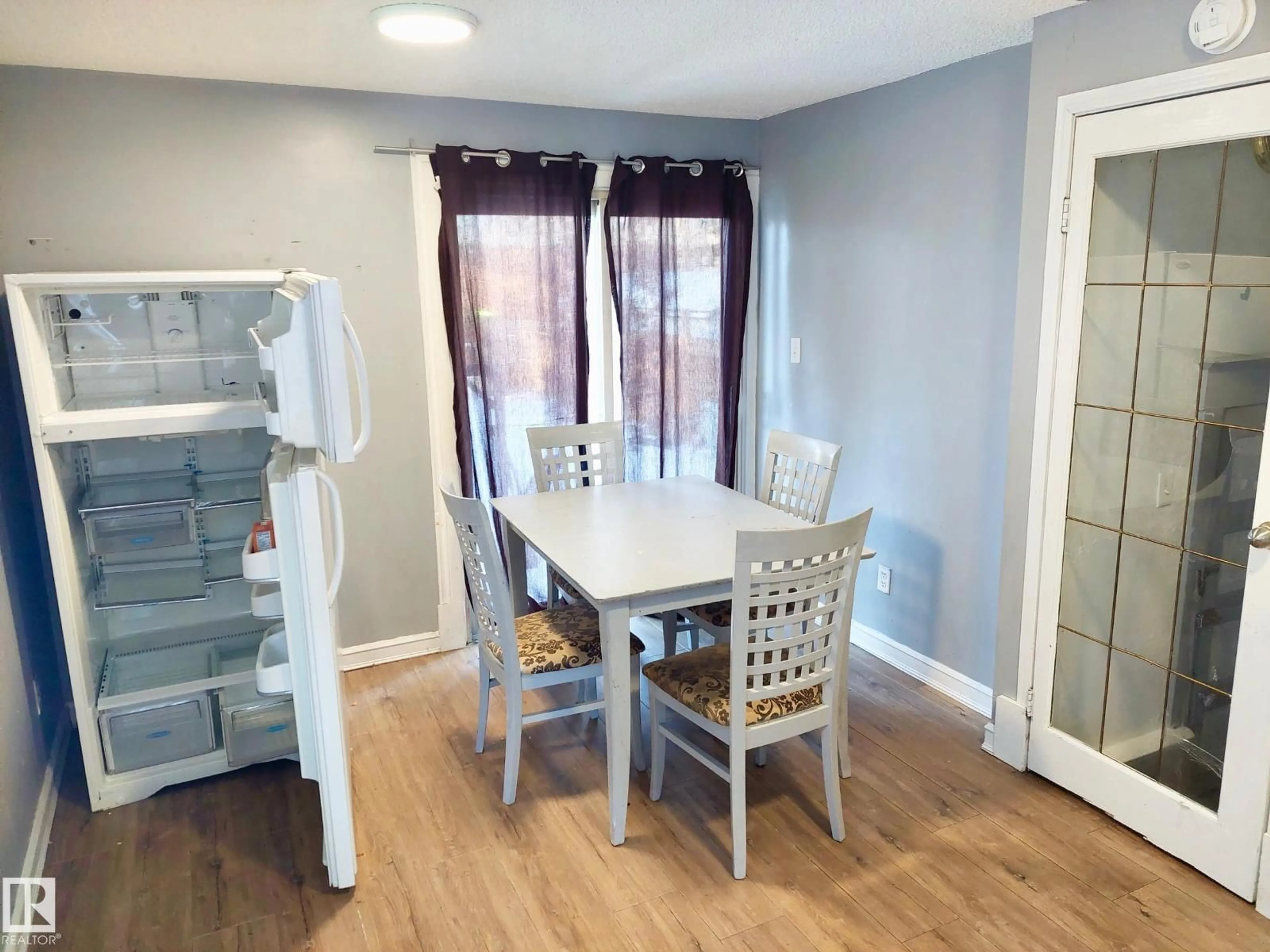 Dining room, wood/laminate floor for 11238 123 ST, Edmonton Alberta T5M0M6