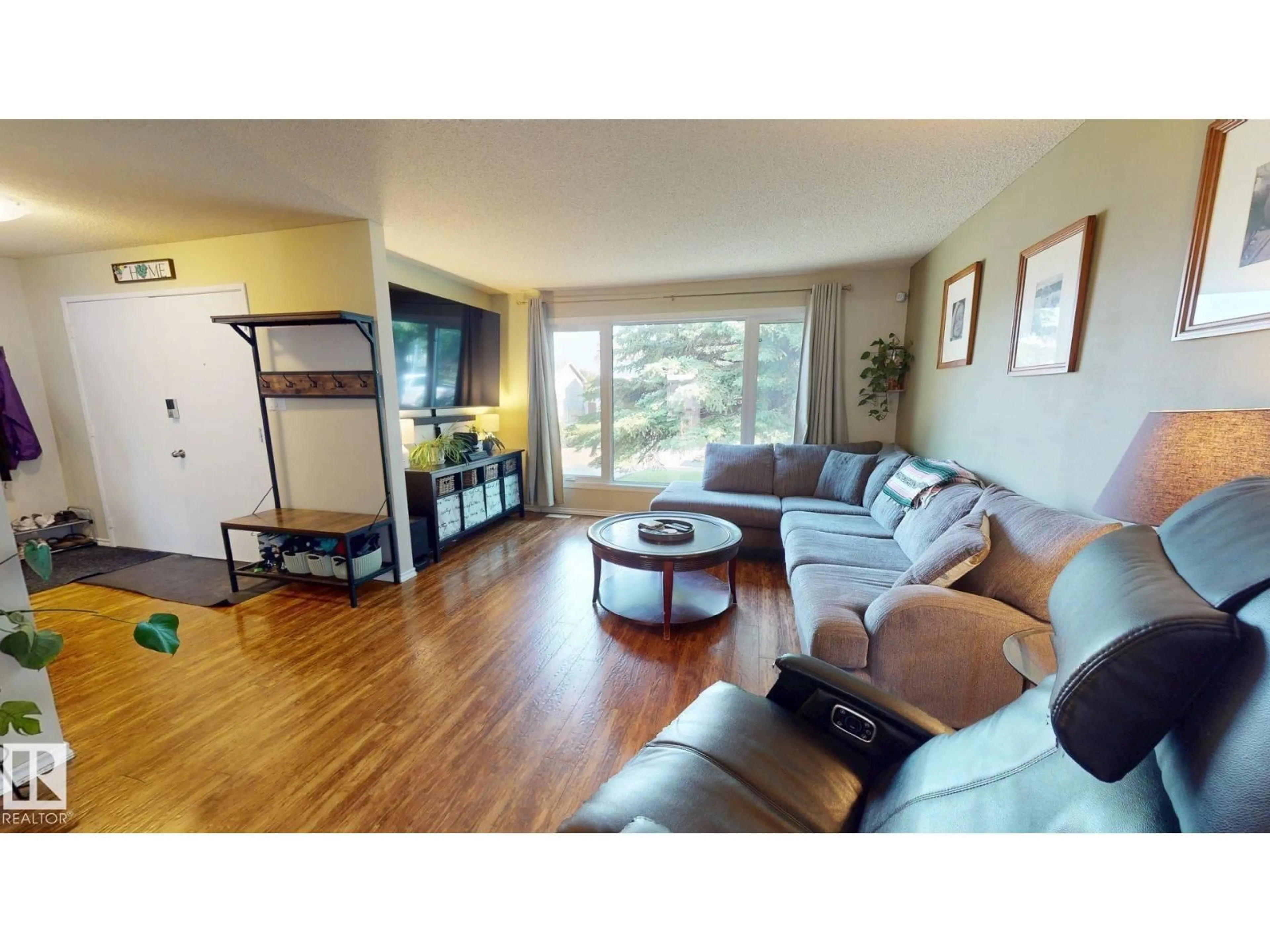 Living room with furniture, wood/laminate floor for 137 GREENWOOD DR, Spruce Grove Alberta T7X1X8