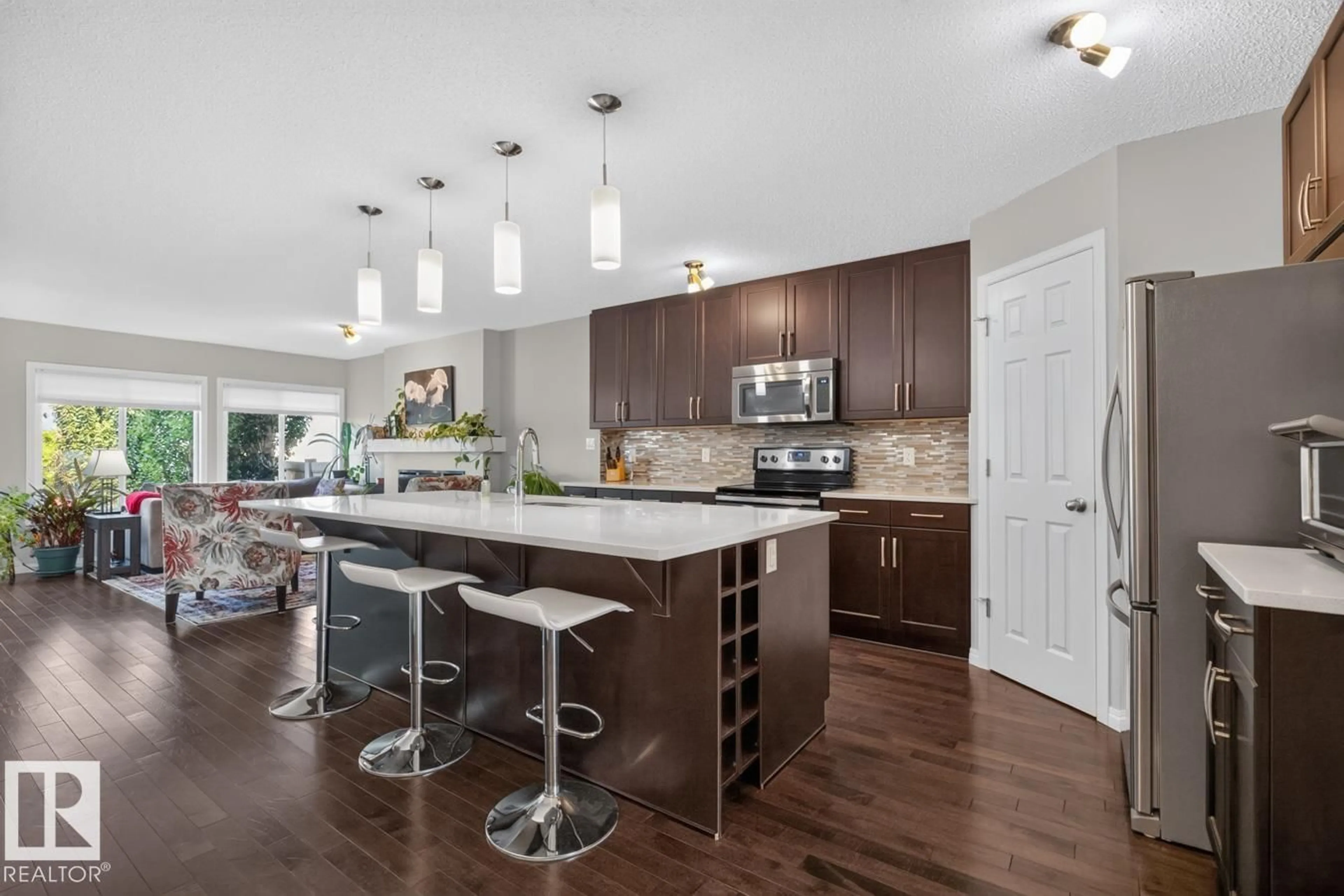 Open concept kitchen, wood/laminate floor for SW SW - 5495 CRABAPPLE LO, Edmonton Alberta T6X1S5