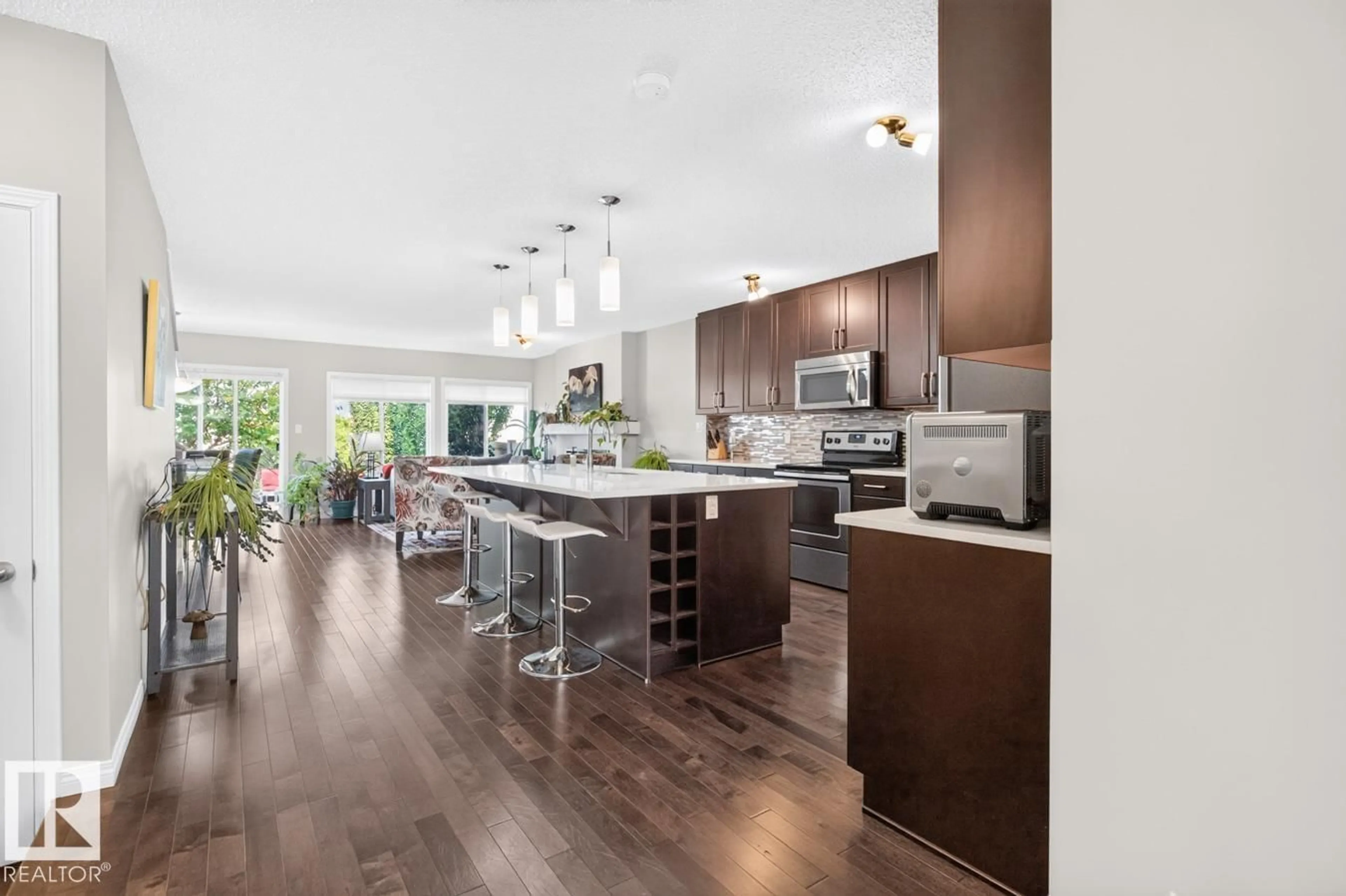 Open concept kitchen, wood/laminate floor for SW SW - 5495 CRABAPPLE LO, Edmonton Alberta T6X1S5
