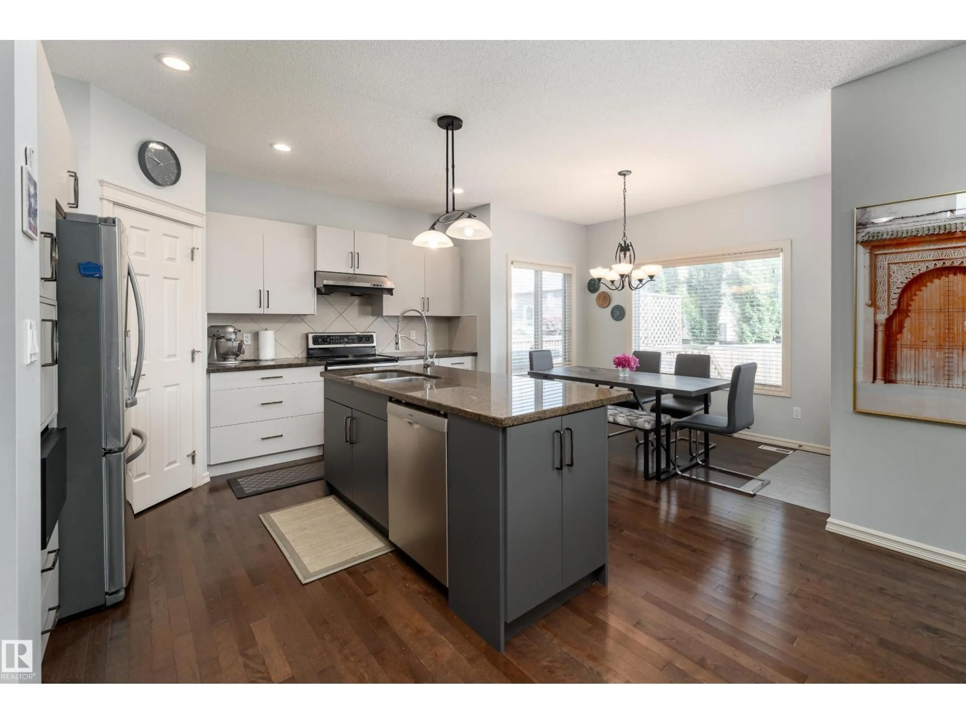 Open concept kitchen, wood/laminate floor for SW - 6736 19 AV, Edmonton Alberta T6X0L8