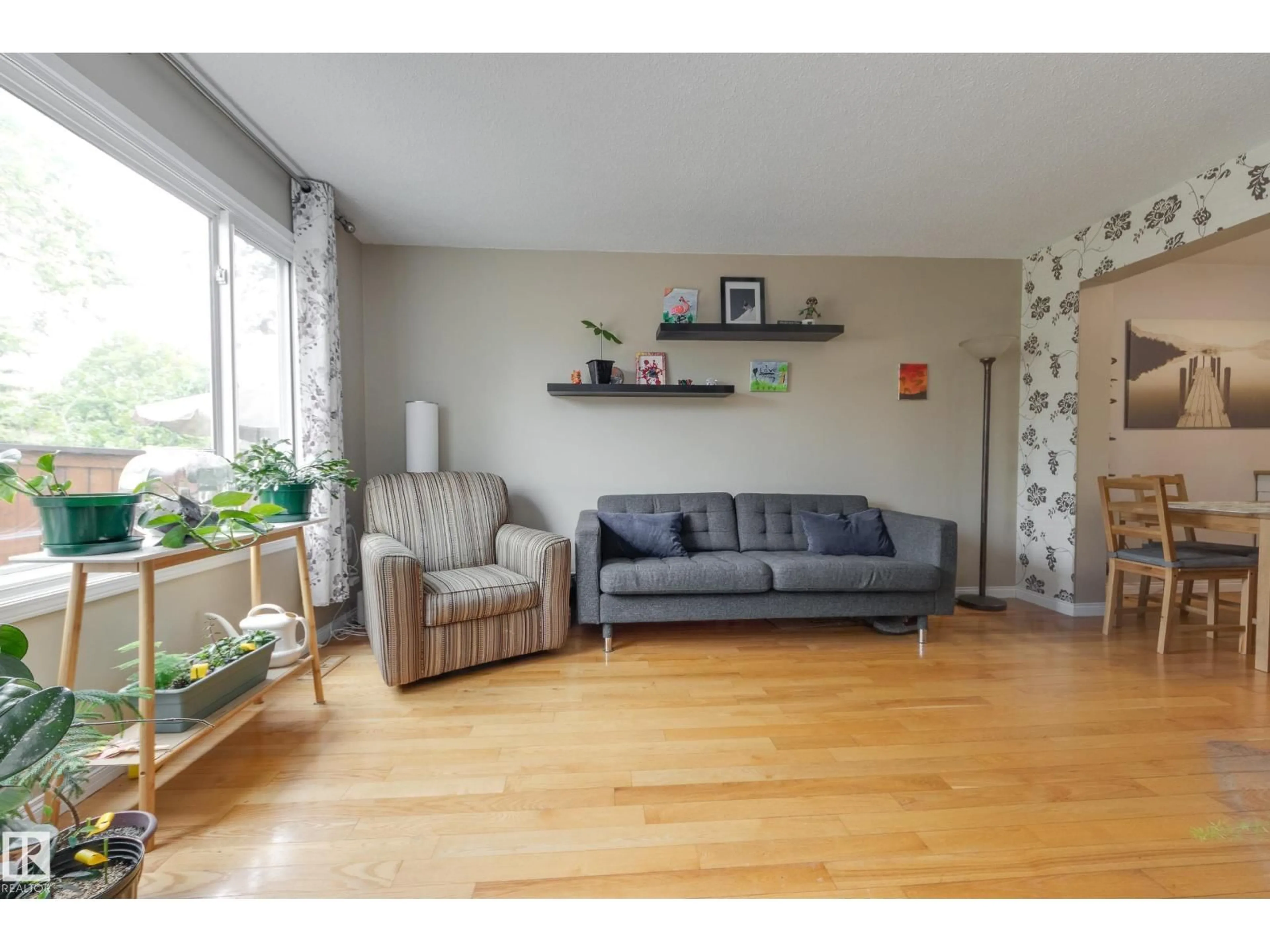 Living room with furniture, wood/laminate floor for 126 PRIMROSE GARDENS GD, Edmonton Alberta T5T0R1