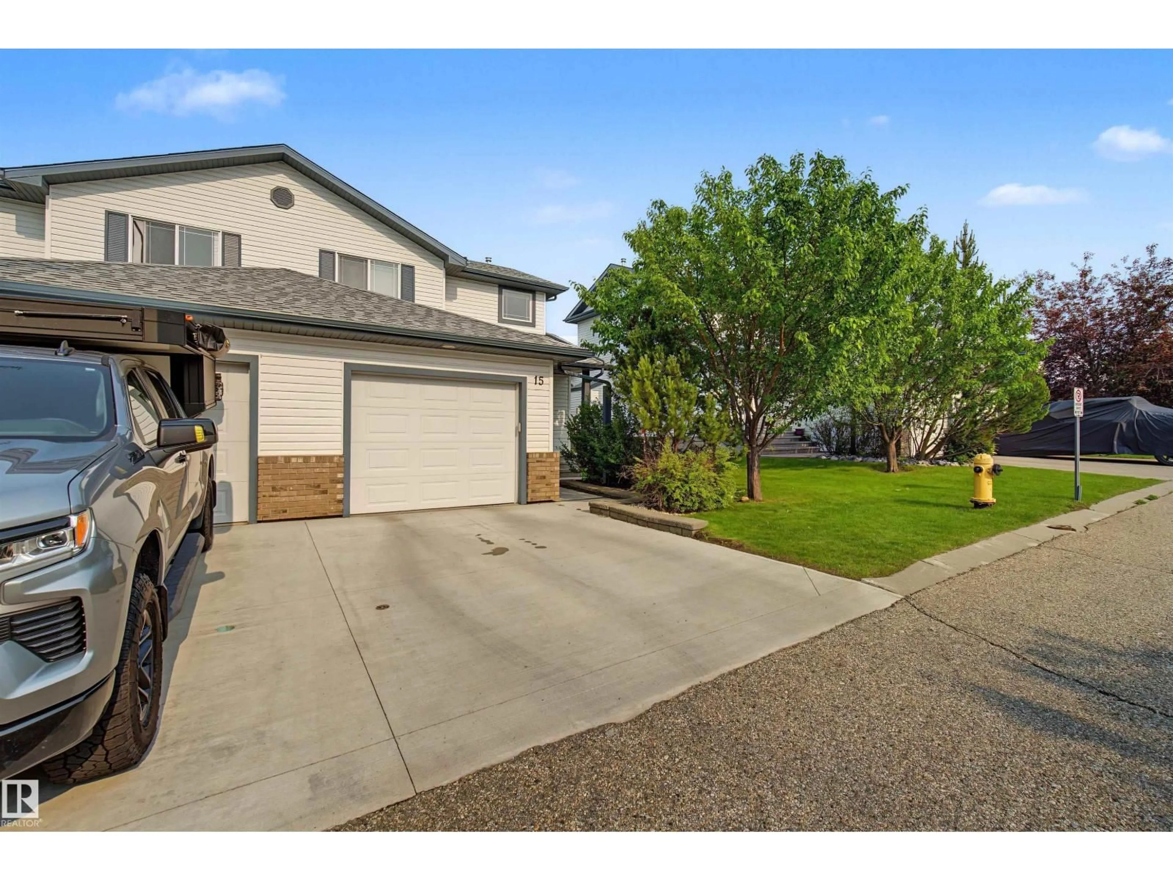 A pic from outside/outdoor area/front of a property/back of a property/a pic from drone, street for 15 - 450 HYNDMAN CR, Edmonton Alberta T5A0E2