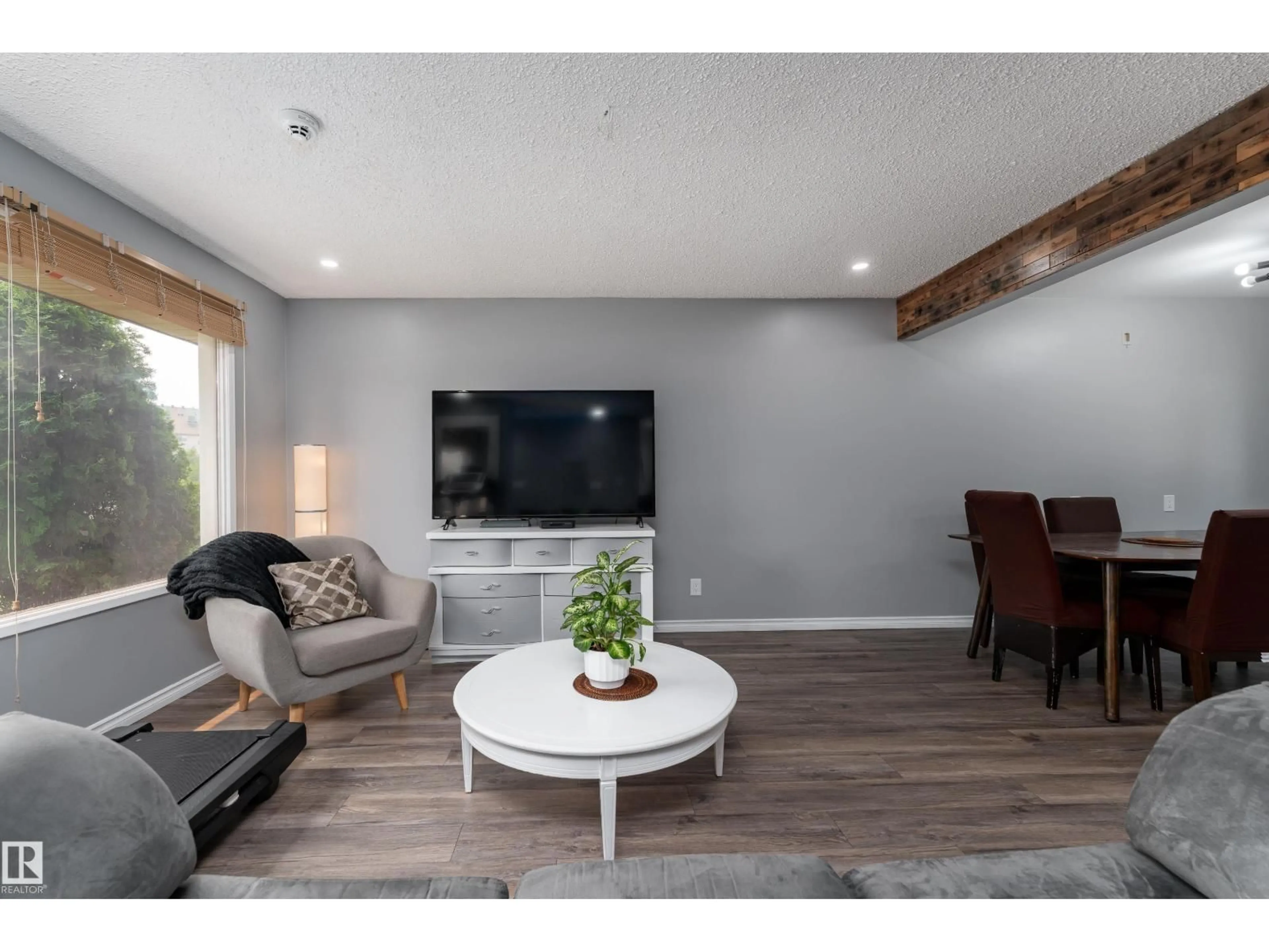 Living room with furniture, wood/laminate floor for 9012 MEADOWLARK RD, Edmonton Alberta T5R5W8
