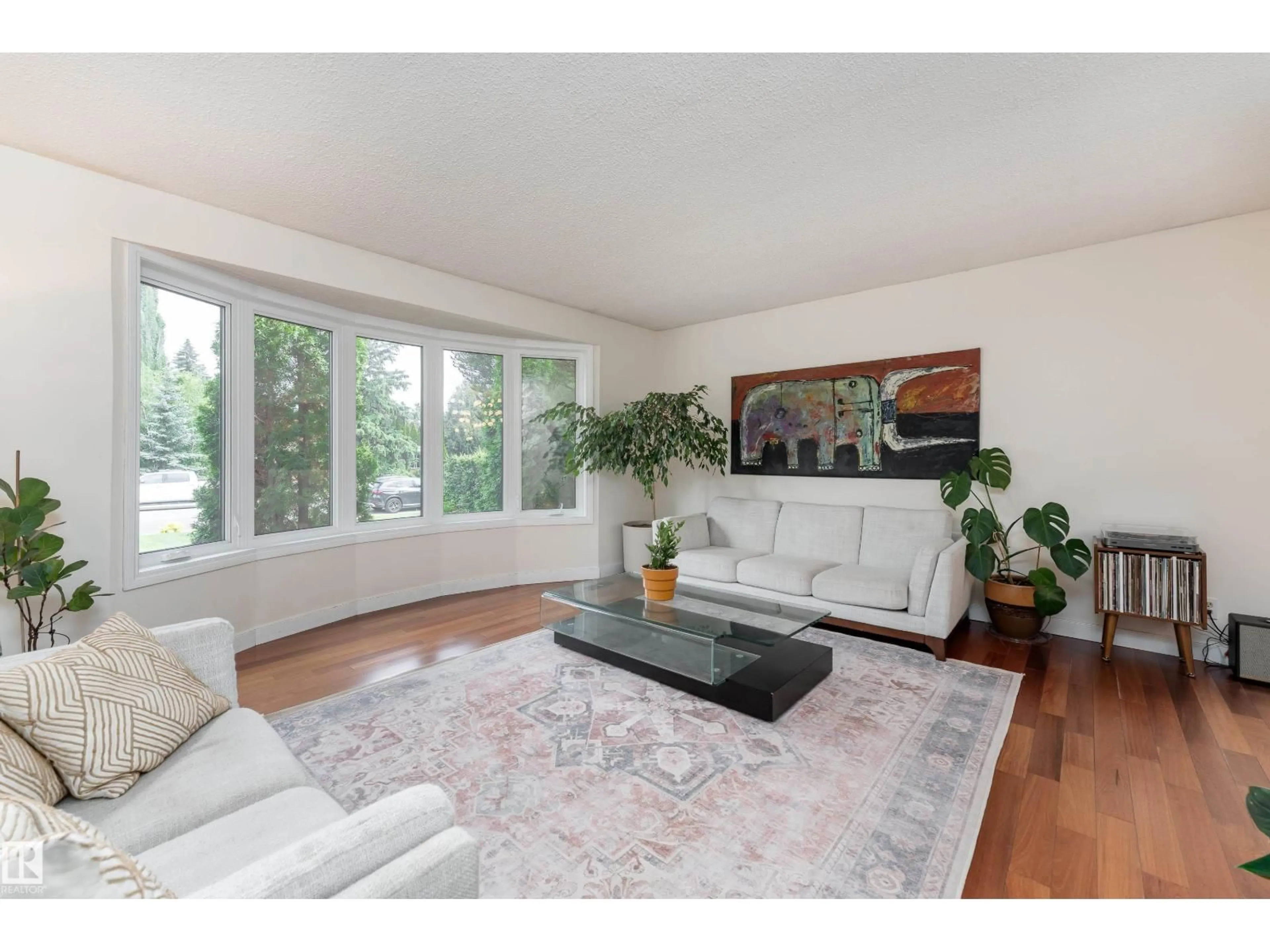 Living room with furniture, wood/laminate floor for NW - 7816 142 ST, Edmonton Alberta T5R0L8
