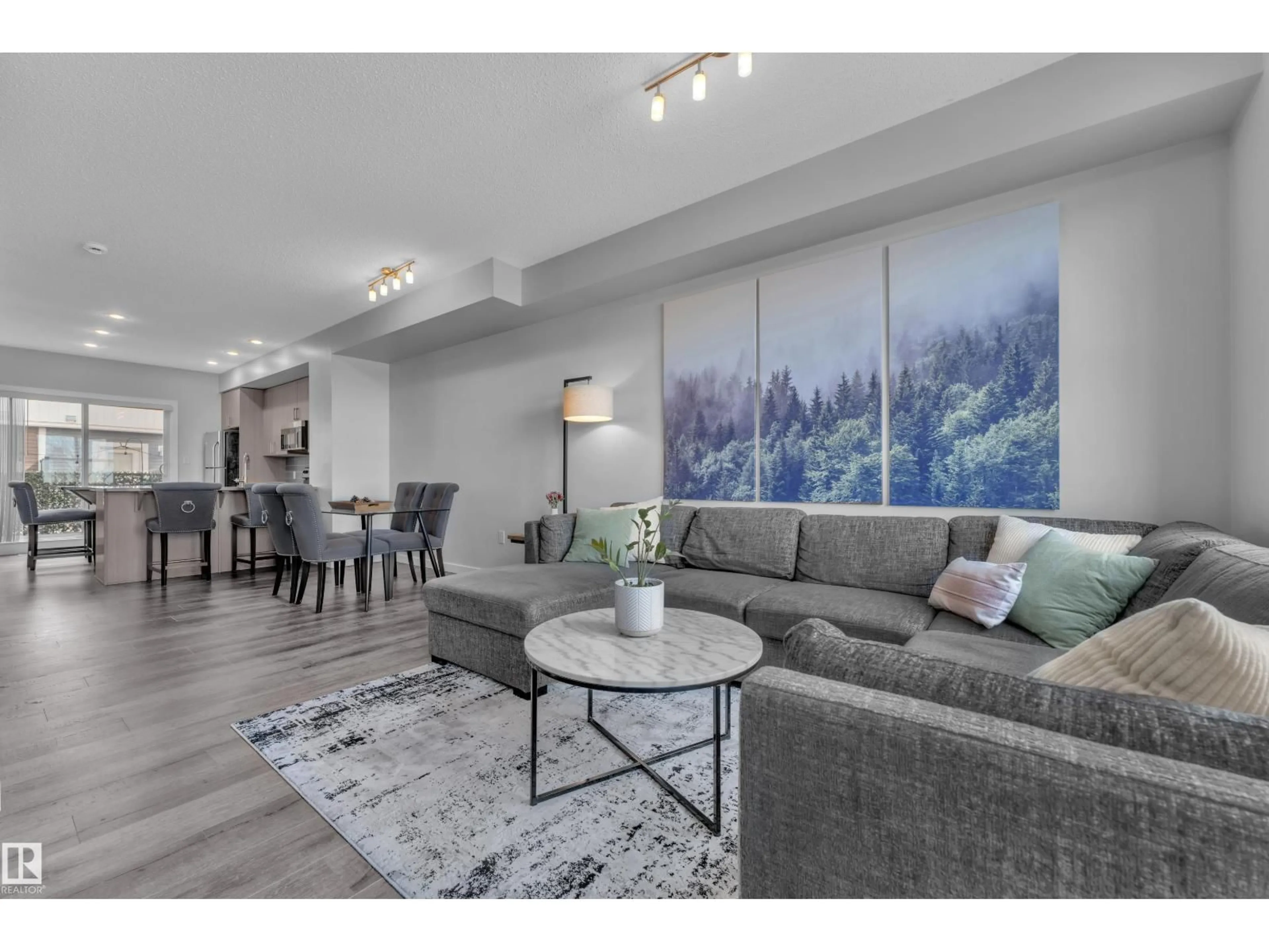 Living room with furniture, unknown for 15 - 2803 JAMES MOWATT TR, Edmonton Alberta T6W2P5