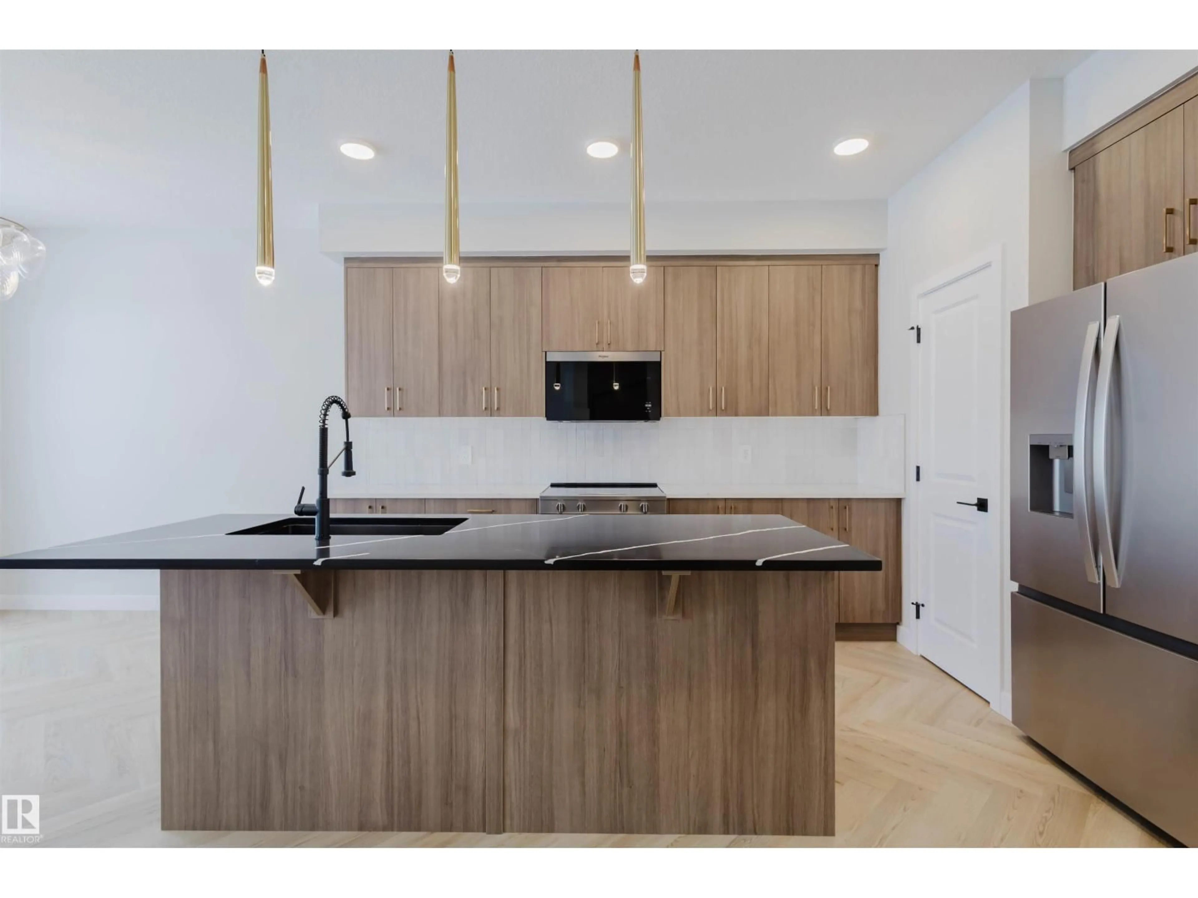 Open concept kitchen, wood/laminate floor for SW - 8300 KIRIAK LO, Edmonton Alberta T6W5S2