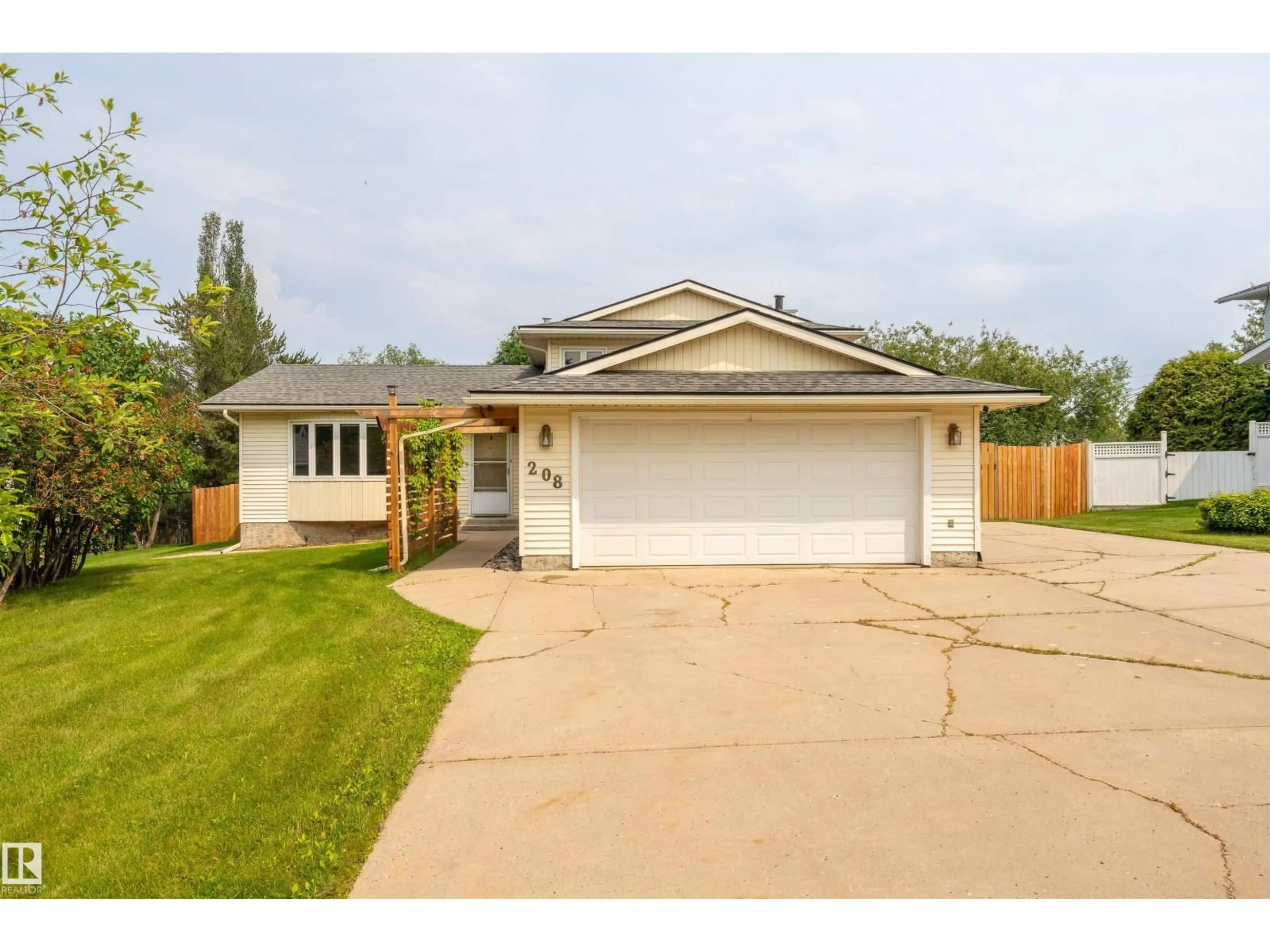 Home with vinyl exterior material, street for 208 18 ST, Cold Lake Alberta T9M1B5