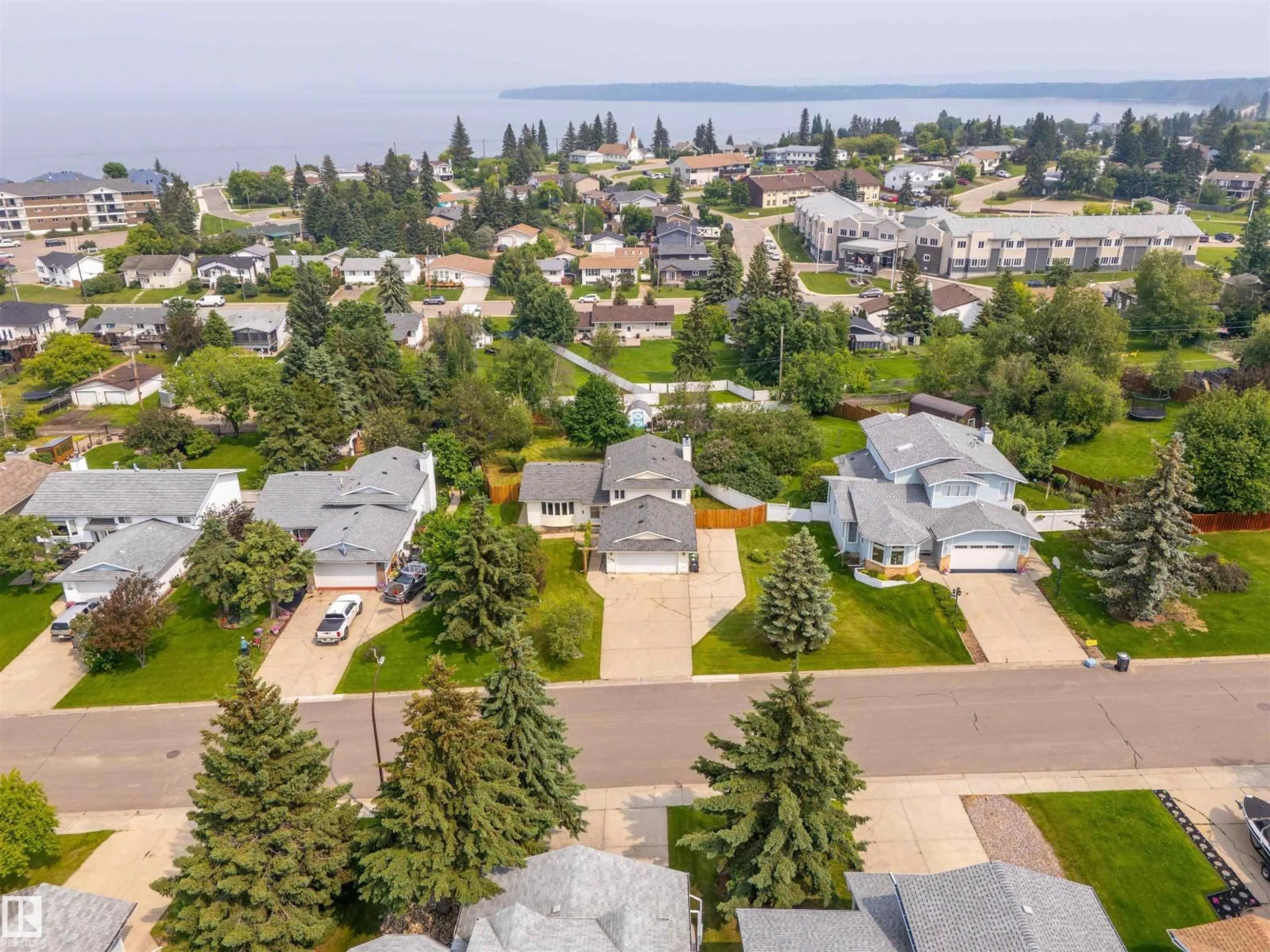 A pic from outside/outdoor area/front of a property/back of a property/a pic from drone, water/lake/river/ocean view for 208 18 ST, Cold Lake Alberta T9M1B5