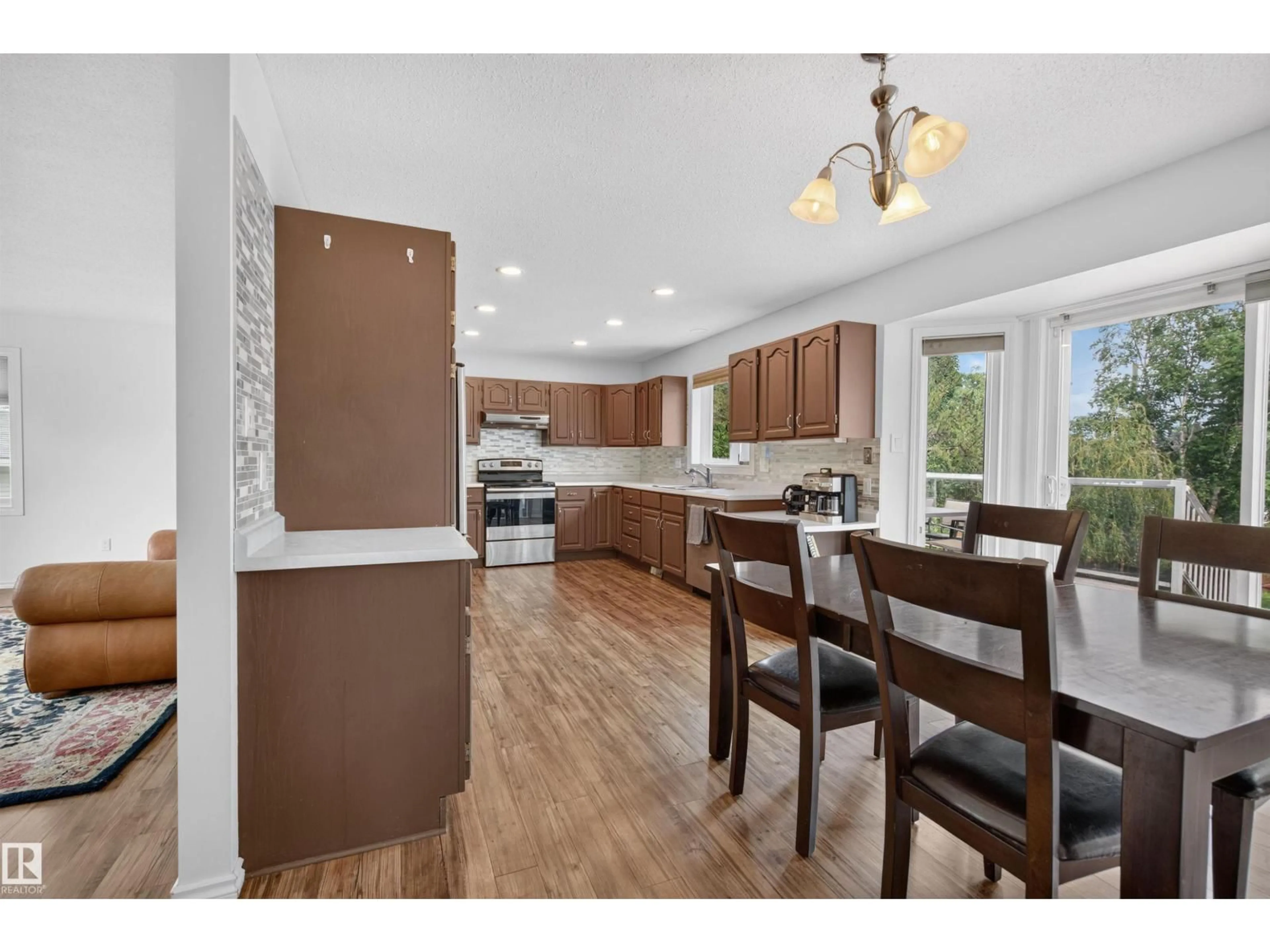 Open concept kitchen, wood/laminate floor for 208 18 ST, Cold Lake Alberta T9M1B5