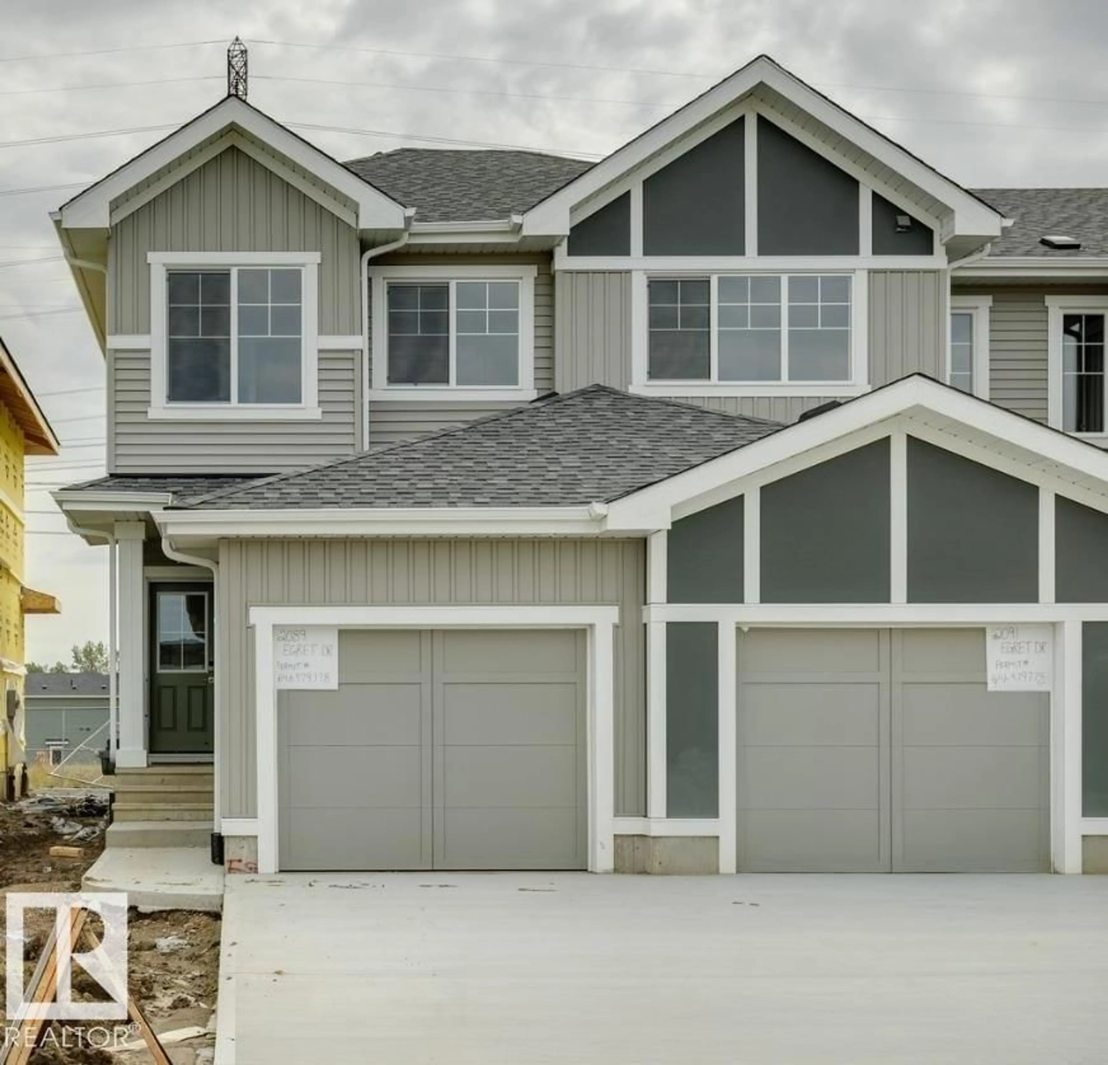 Home with vinyl exterior material, street for 2089 EGRET DR, Edmonton Alberta T6M3G7