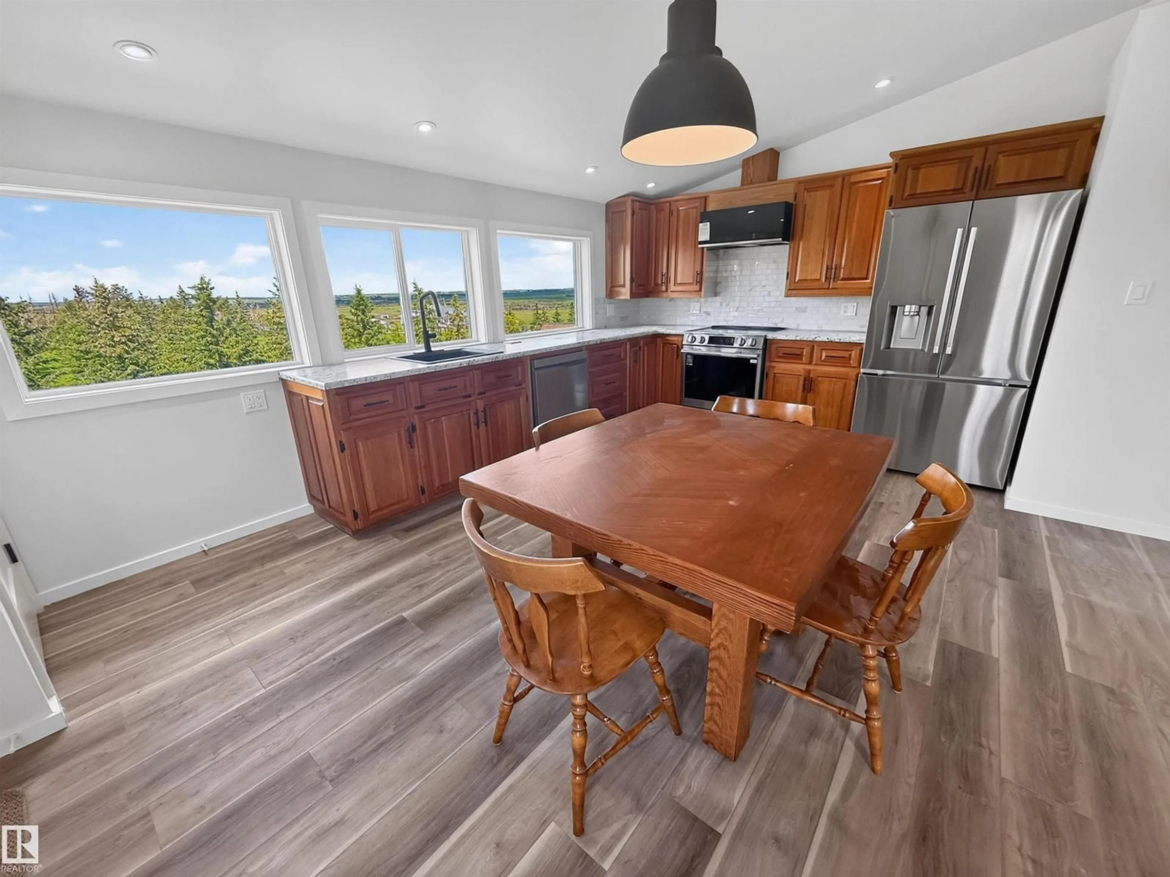 Open concept kitchen, wood/laminate floor for 55301 RANGE ROAD 272, Rural Sturgeon County Alberta T8R0P5