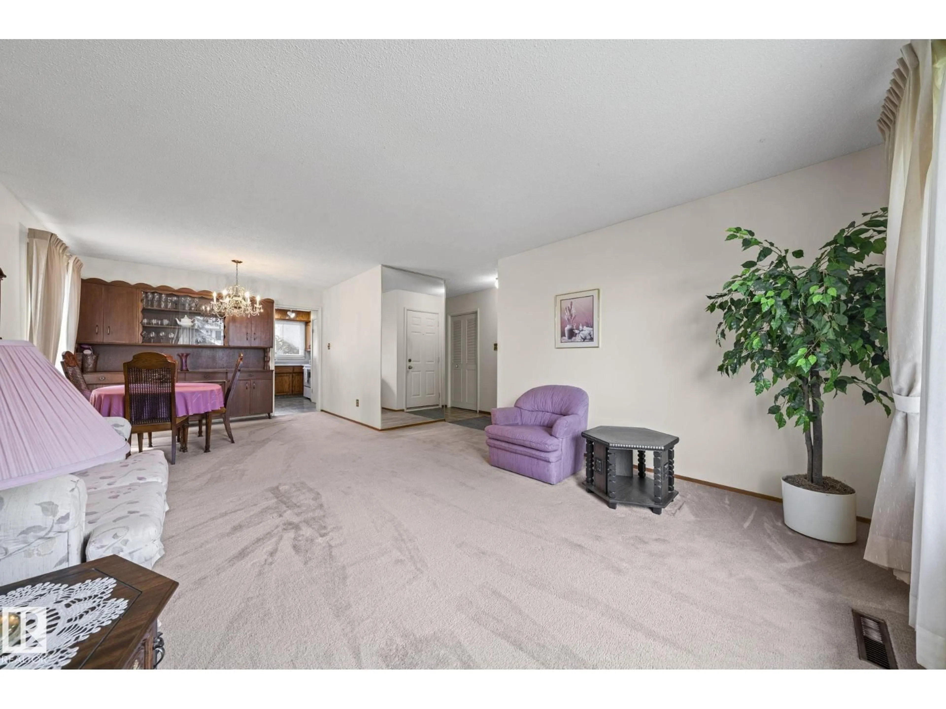 Living room with furniture, unknown for 8323 142 AV, Edmonton Alberta T5E2G3