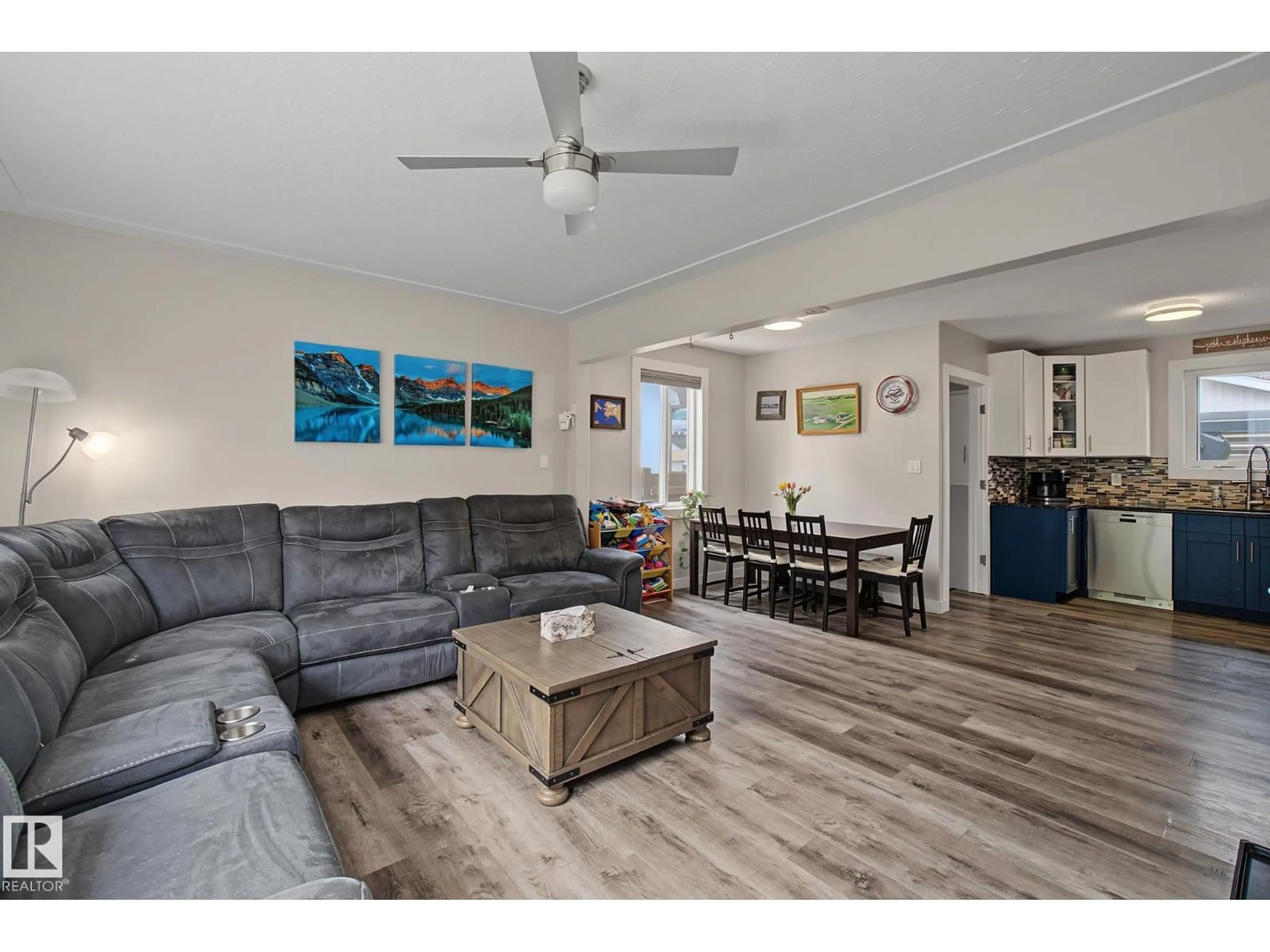 Living room with furniture, wood/laminate floor for 3622 115 AV, Edmonton Alberta T5W0T9