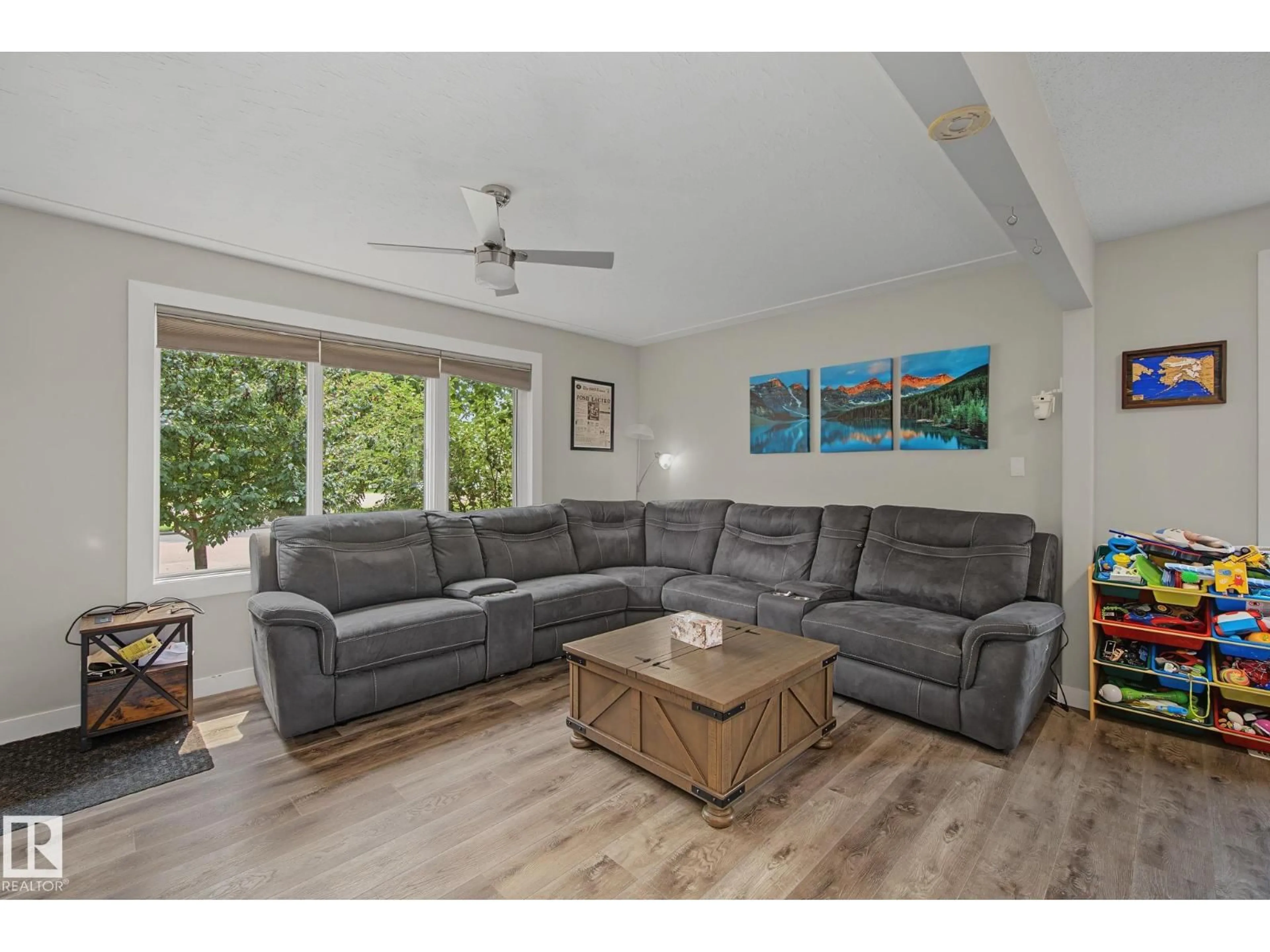 Living room with furniture, wood/laminate floor for 3622 115 AV, Edmonton Alberta T5W0T9