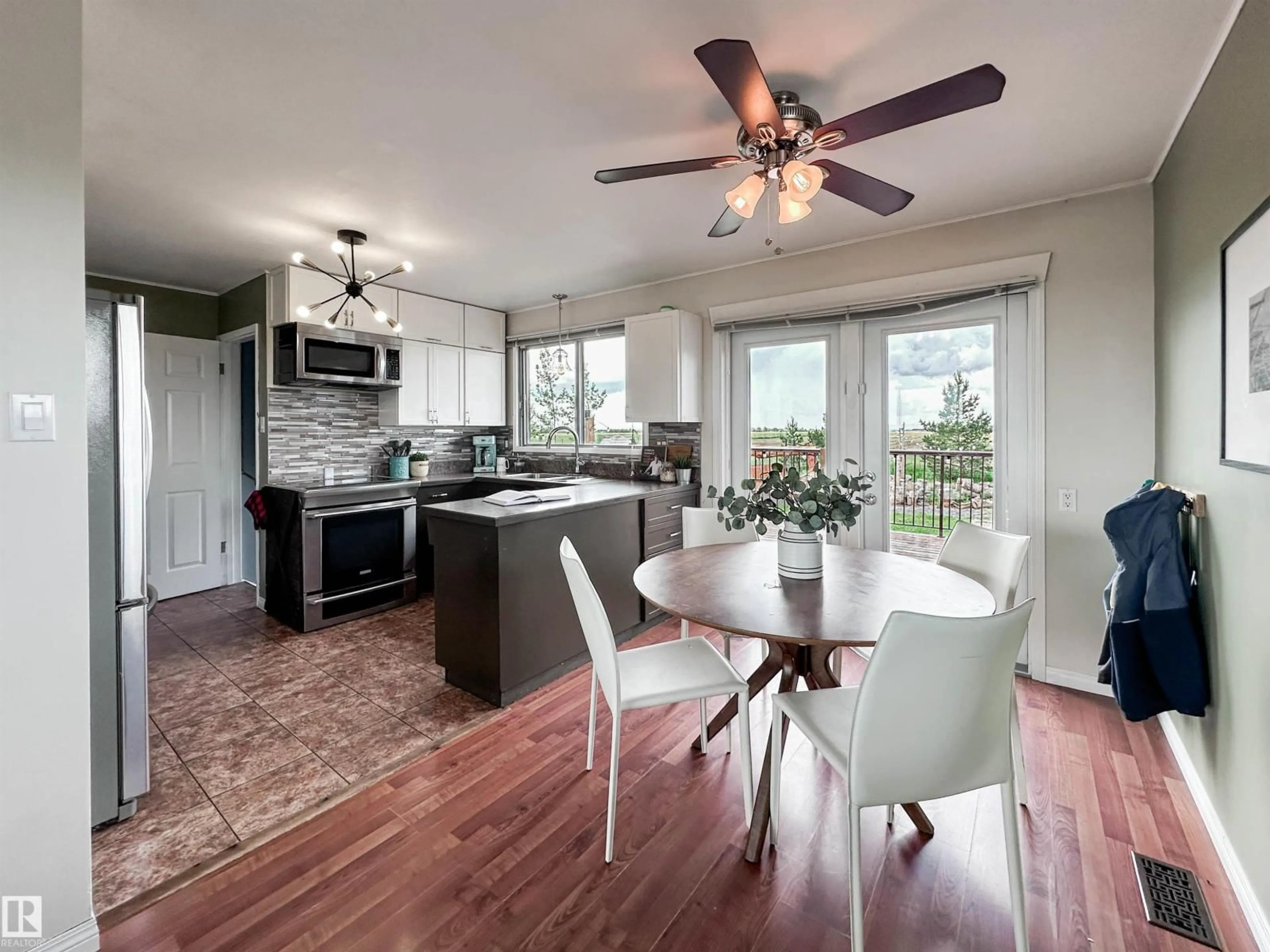 Open concept kitchen, wood/laminate floor for 55310 RGE ROAD 261, Rural Sturgeon County Alberta T8R0V6