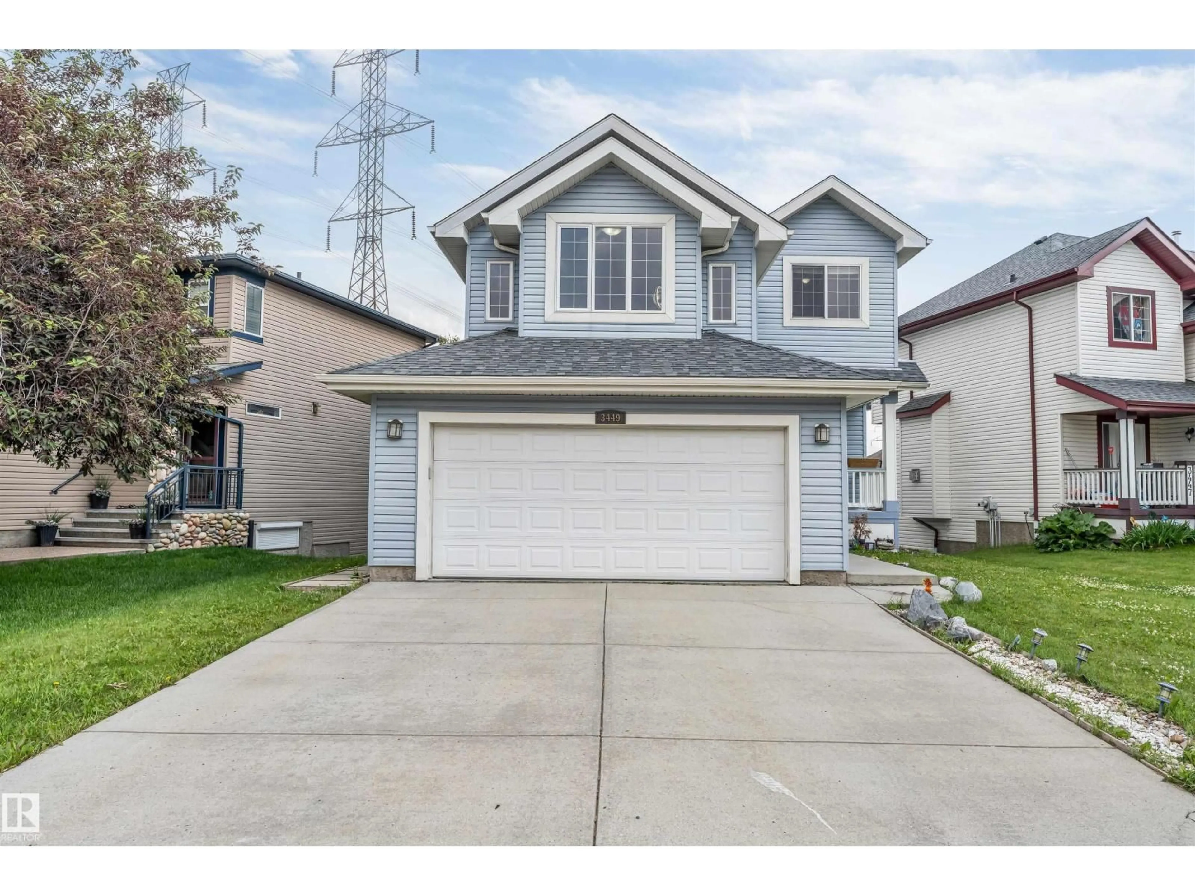 Home with vinyl exterior material, street for 3449 28 ST, Edmonton Alberta T6T2A5