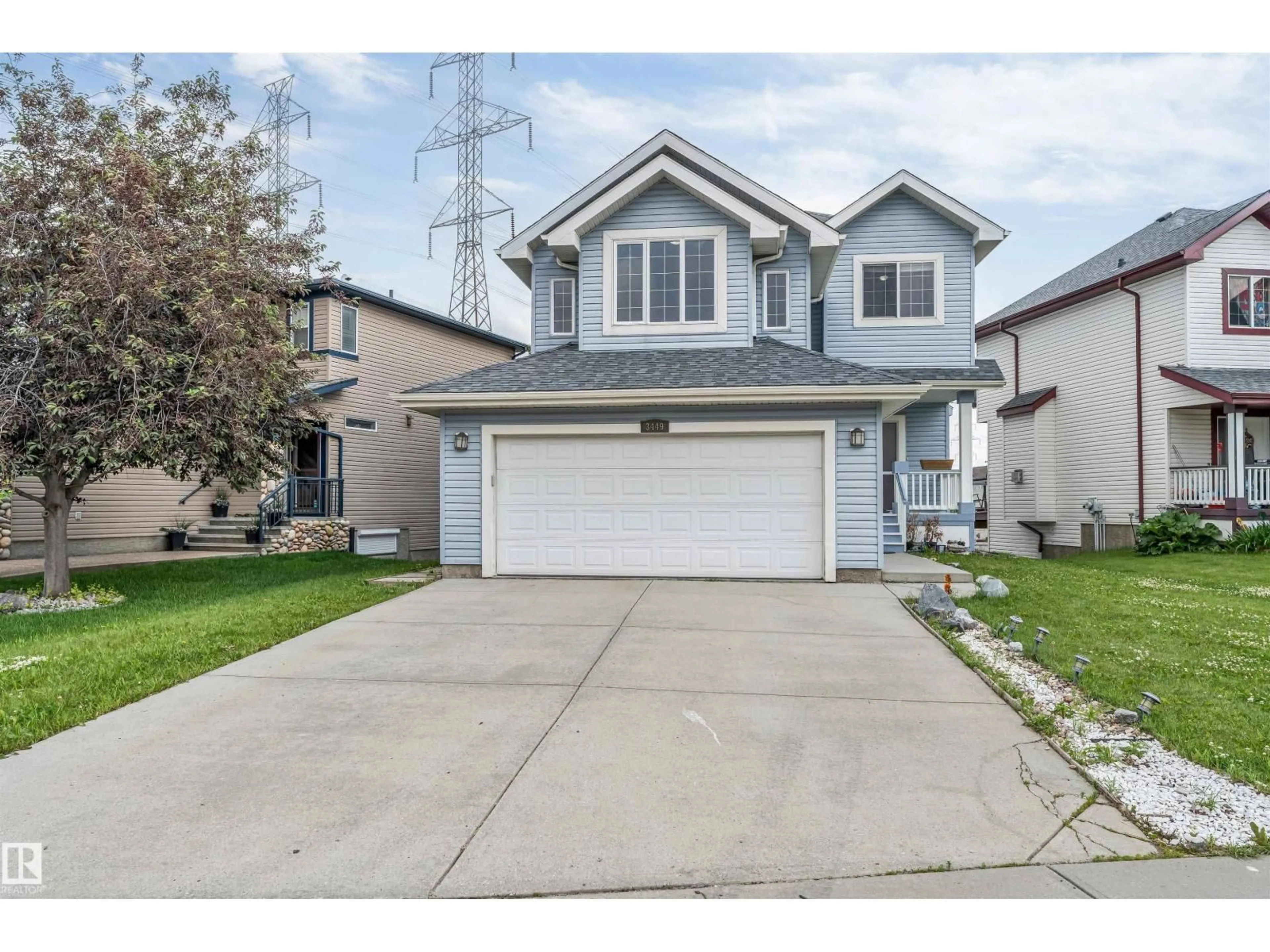 Home with vinyl exterior material, street for 3449 28 ST, Edmonton Alberta T6T2A5