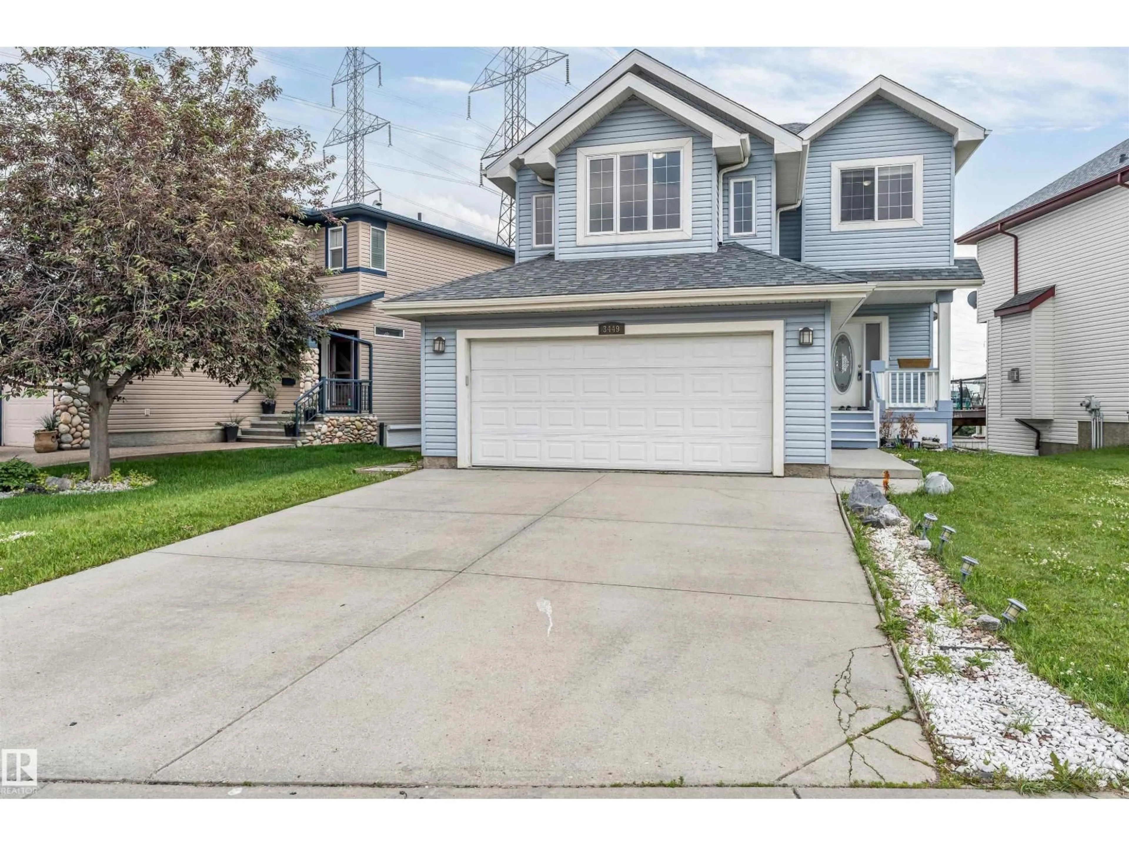Home with vinyl exterior material, street for 3449 28 ST, Edmonton Alberta T6T2A5