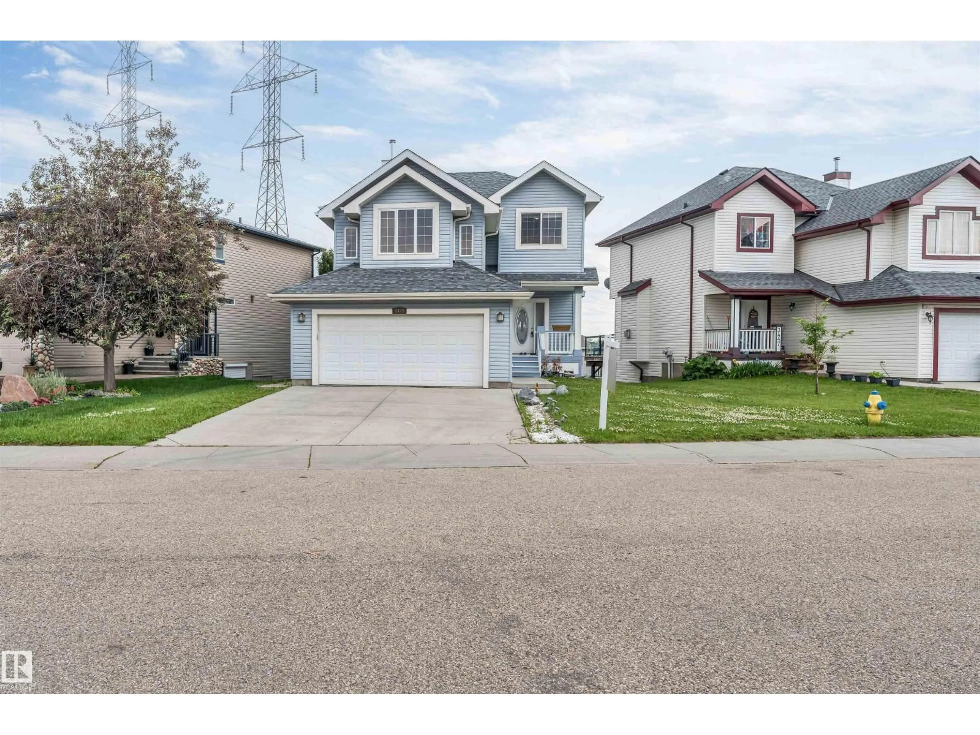 Home with vinyl exterior material, street for 3449 28 ST, Edmonton Alberta T6T2A5