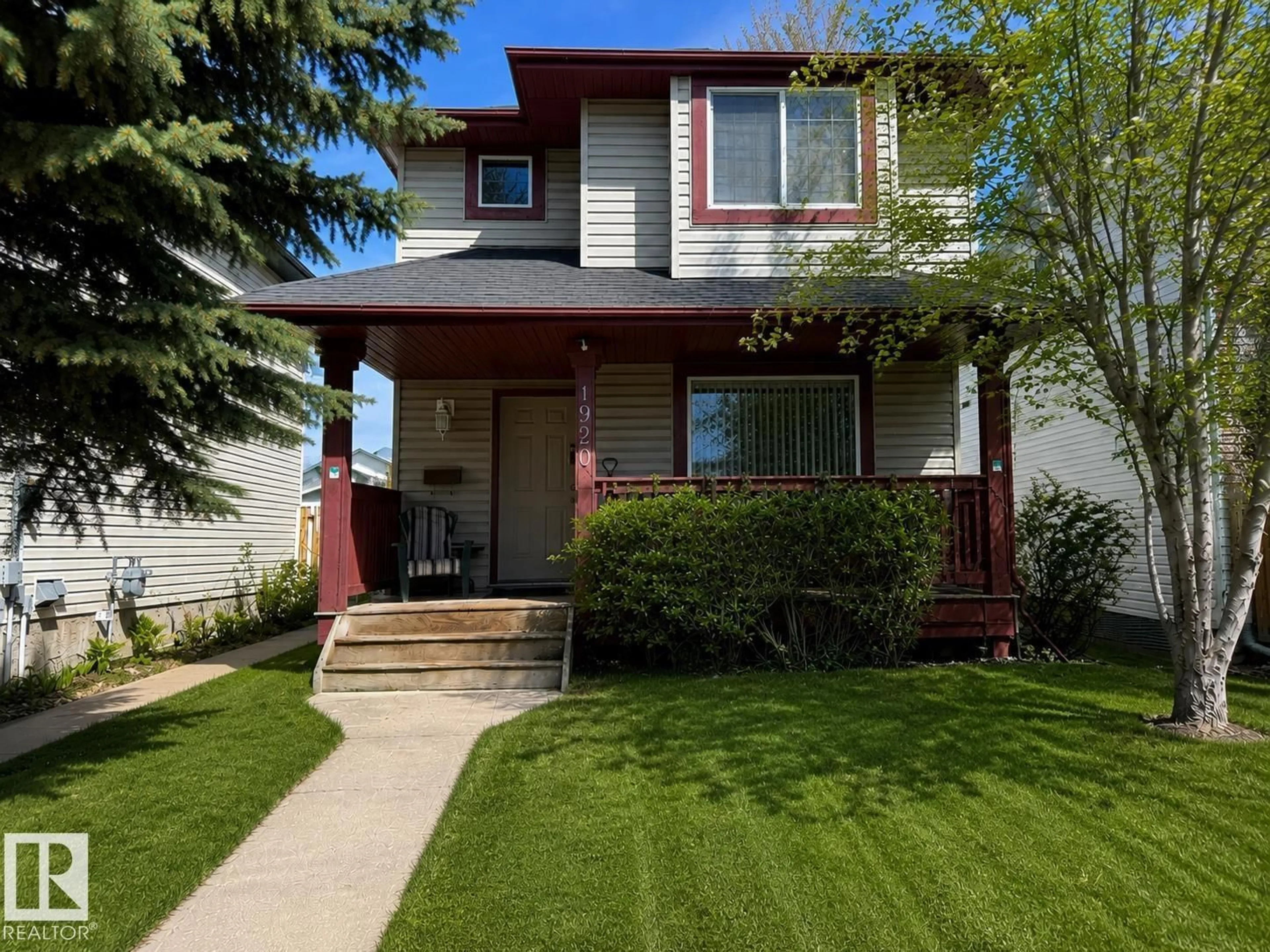 Home with vinyl exterior material, street for 1920 37 AV, Edmonton Alberta T6T1S7