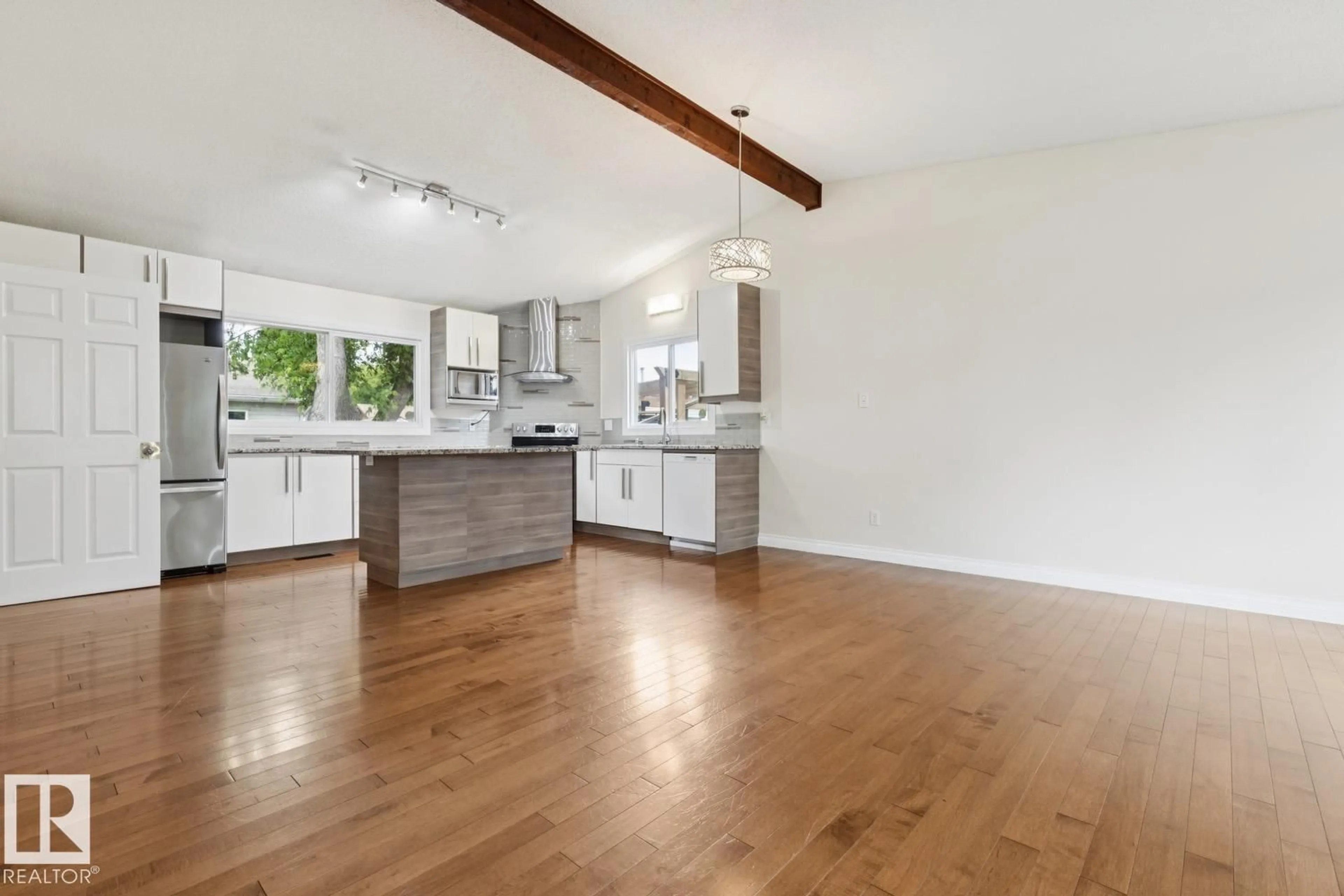 Open concept kitchen, wood/laminate floor for 8803 25A AV, Edmonton Alberta T6K2W6