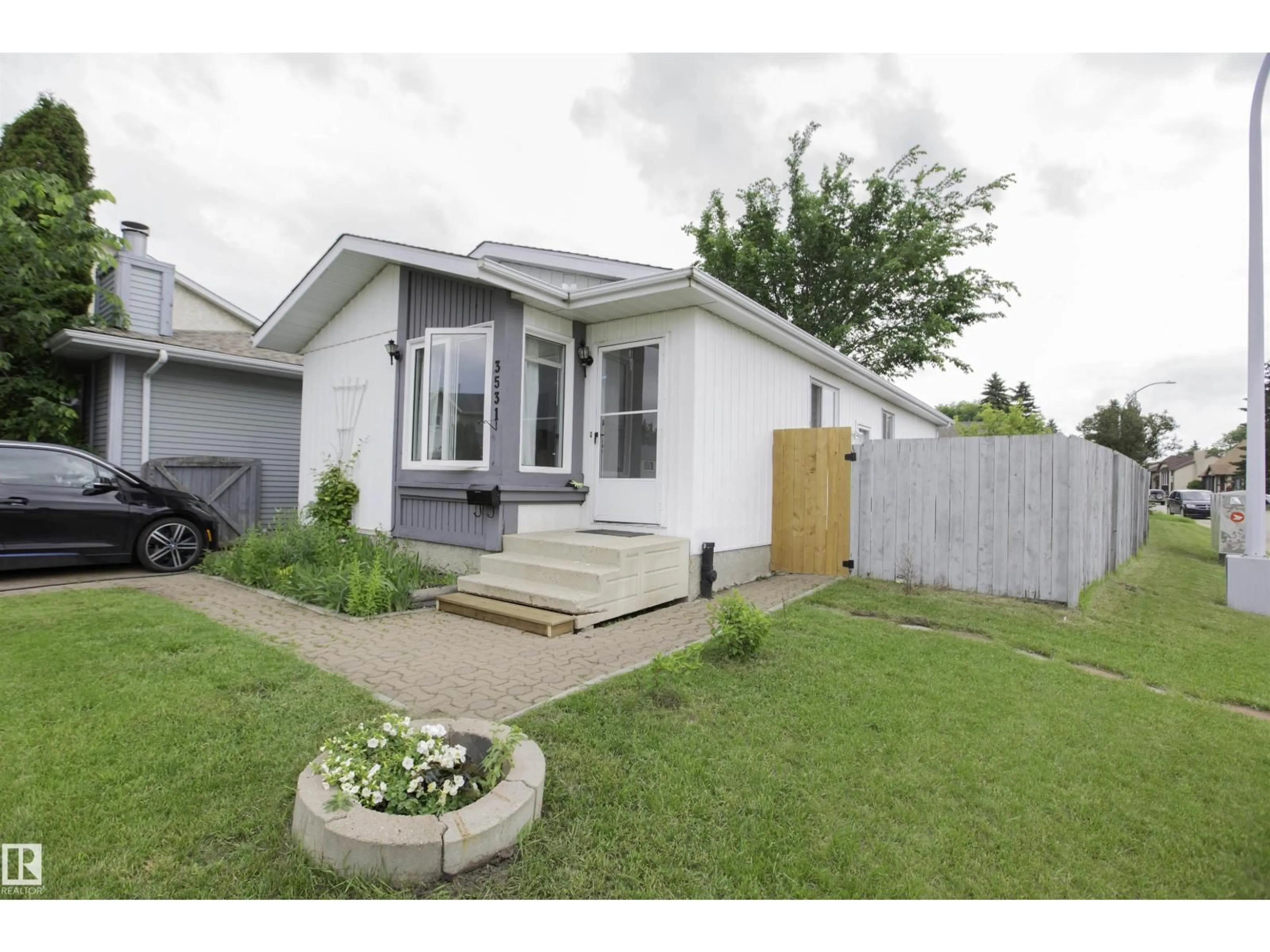 Home with vinyl exterior material, street for NW - 3531 46 ST, Edmonton Alberta T6L5C6