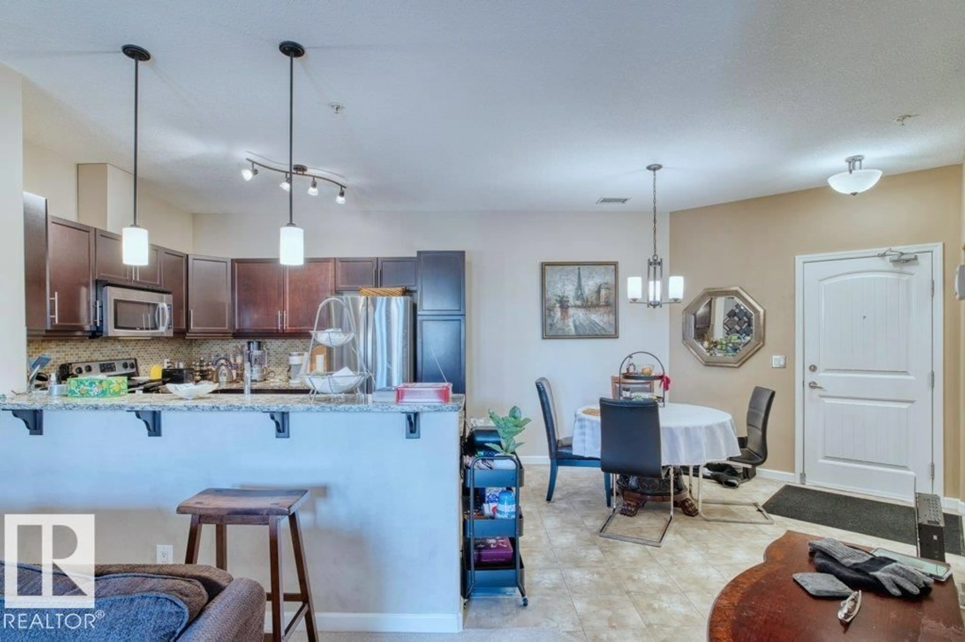 Open concept kitchen, ceramic/tile floor for 319 - 6083 MAYNARD WY, Edmonton Alberta T6R0S5