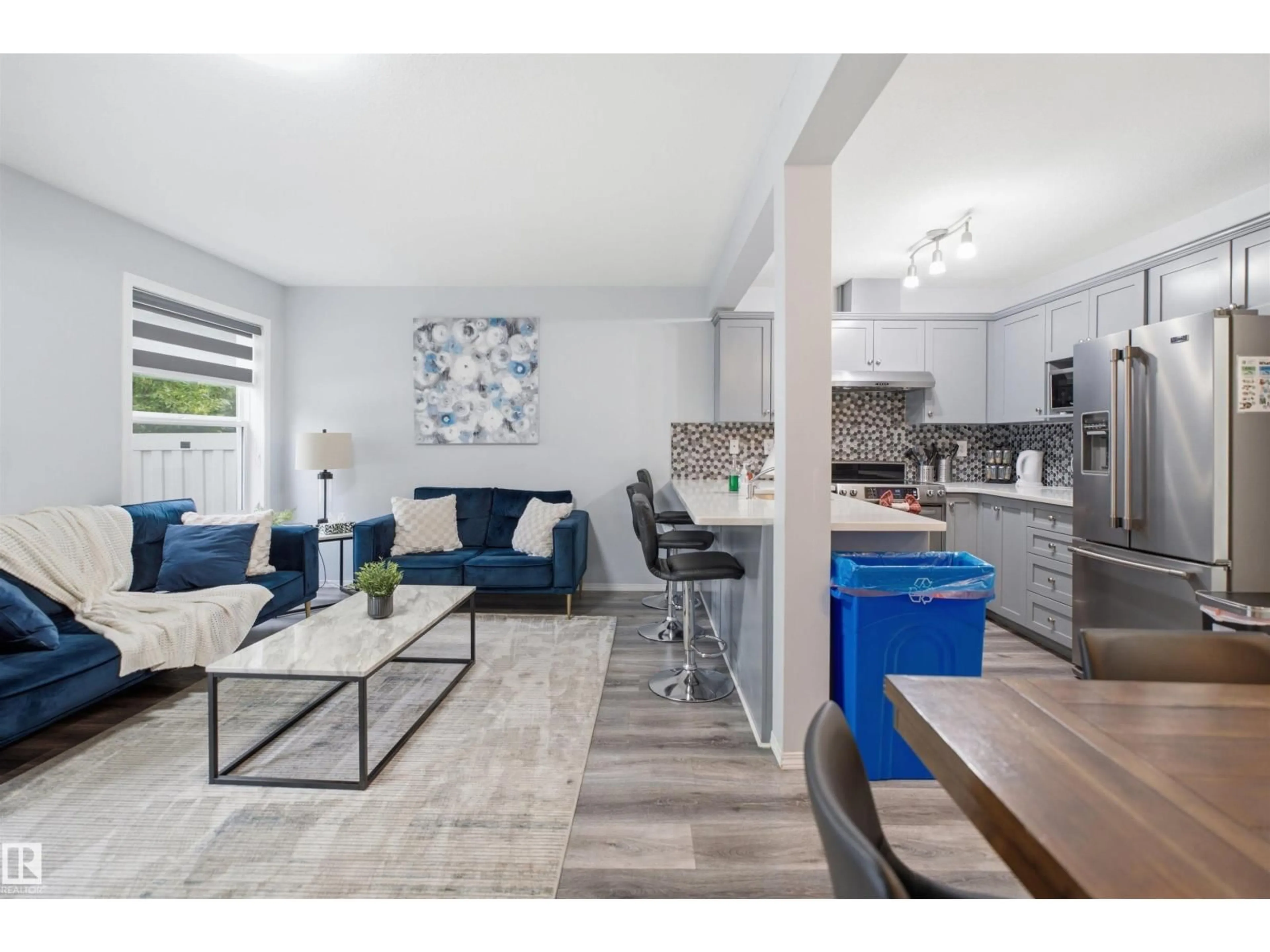 Open concept kitchen, wood/laminate floor for 230 - 92 EDWARDS DRIVE, Edmonton Alberta T6X1G7