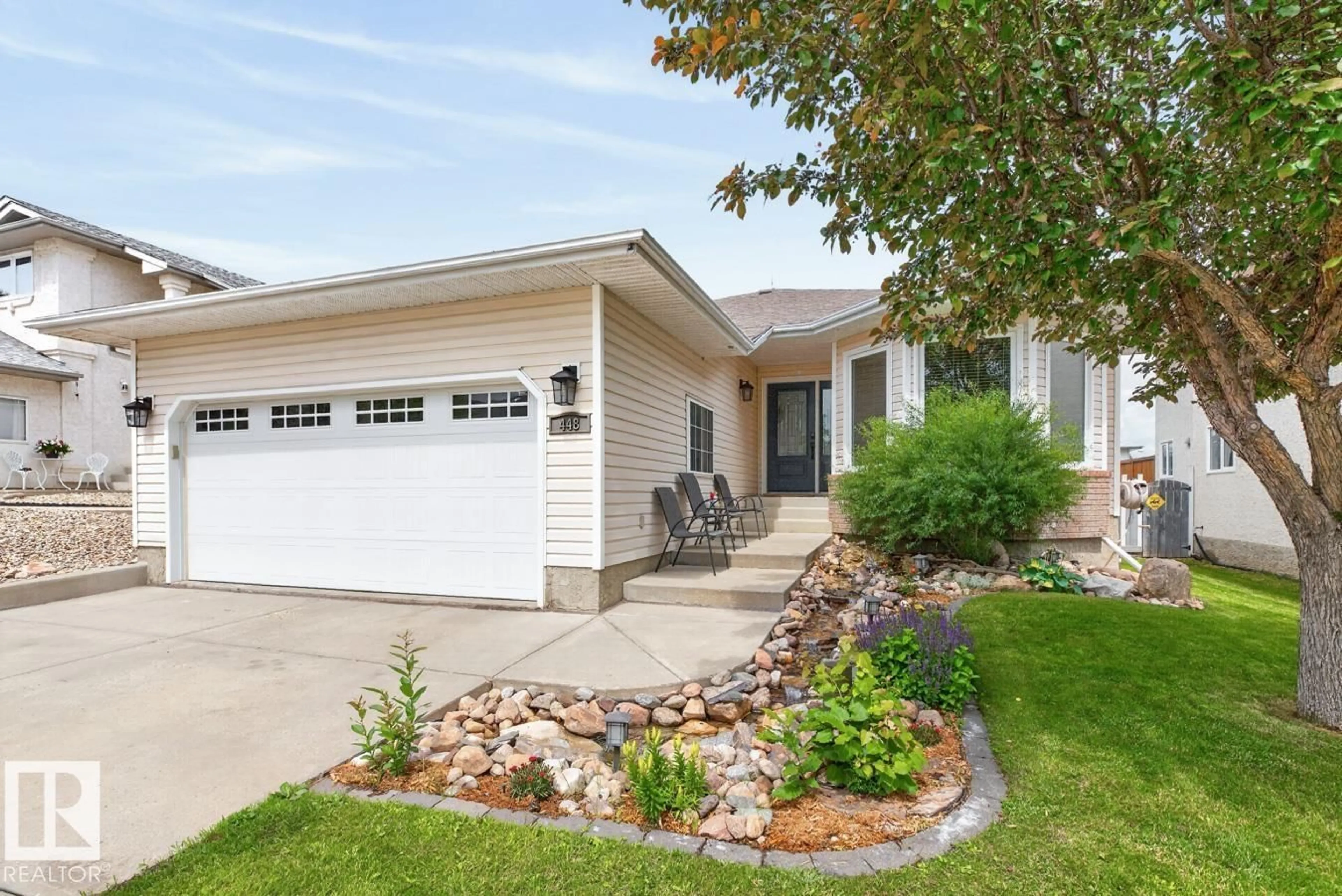 Home with vinyl exterior material, street for NW - 448 ORMSBY RD W, Edmonton Alberta T5T6B1