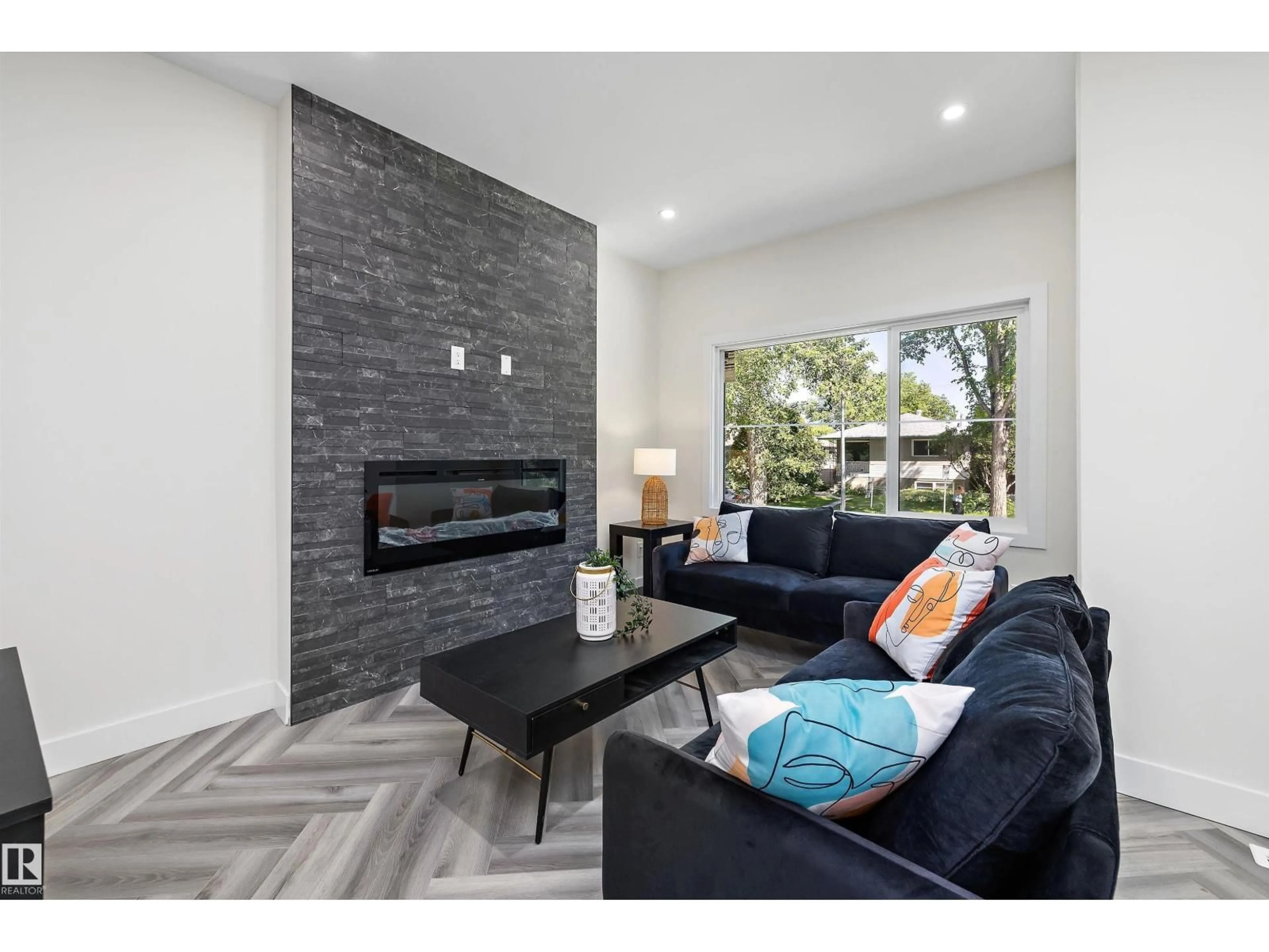 Living room with furniture, ceramic/tile floor for 8319 81 AV, Edmonton Alberta T6C0W1