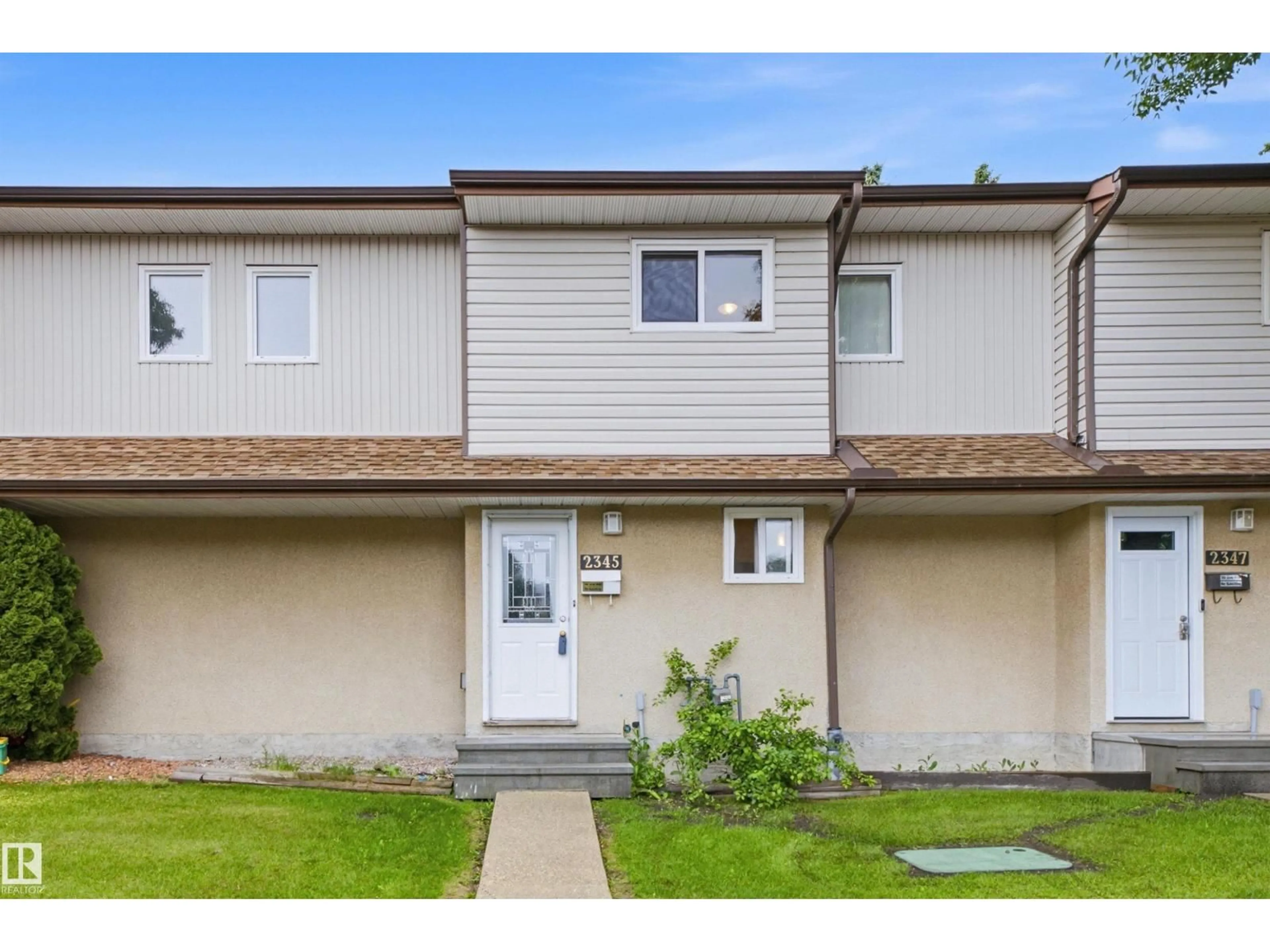 Home with vinyl exterior material, street for 2345 139 AV, Edmonton Alberta T5Y1S1