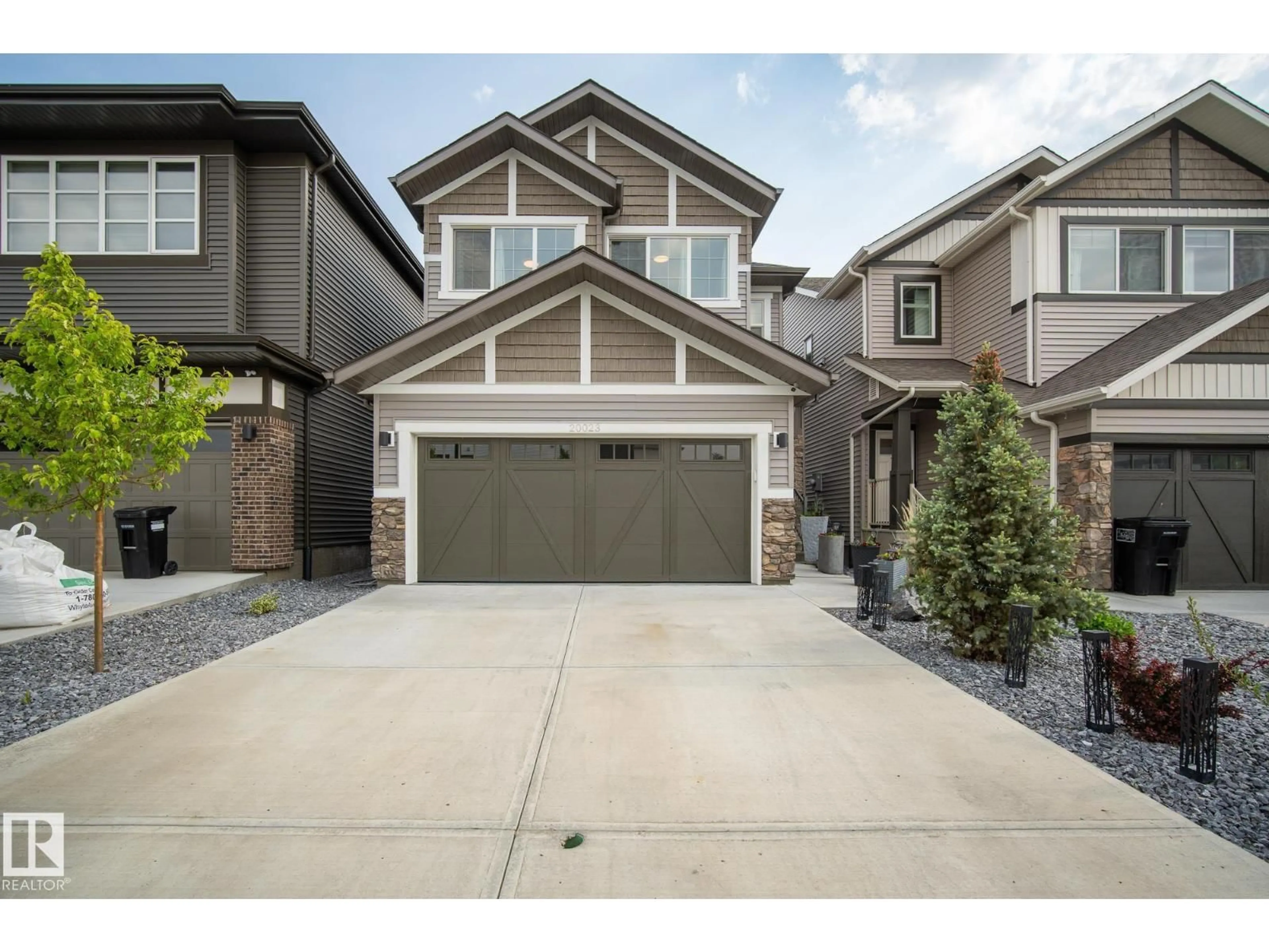 Home with vinyl exterior material, street for NW - 20023 26 AV, Edmonton Alberta T6M1K3