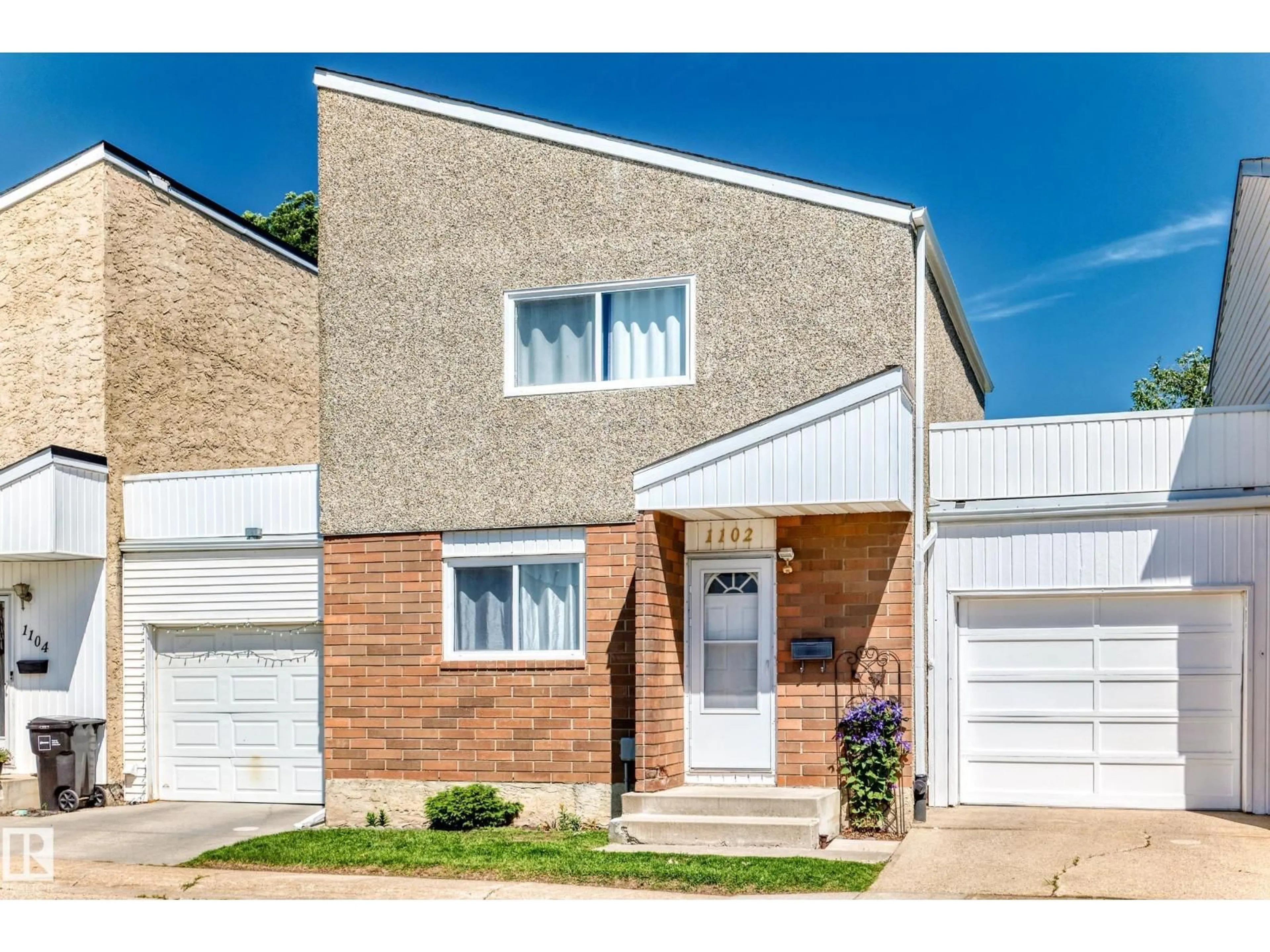 Home with brick exterior material, street for 1102 MILLBOURNE RD E NW, Edmonton Alberta T6K1W1