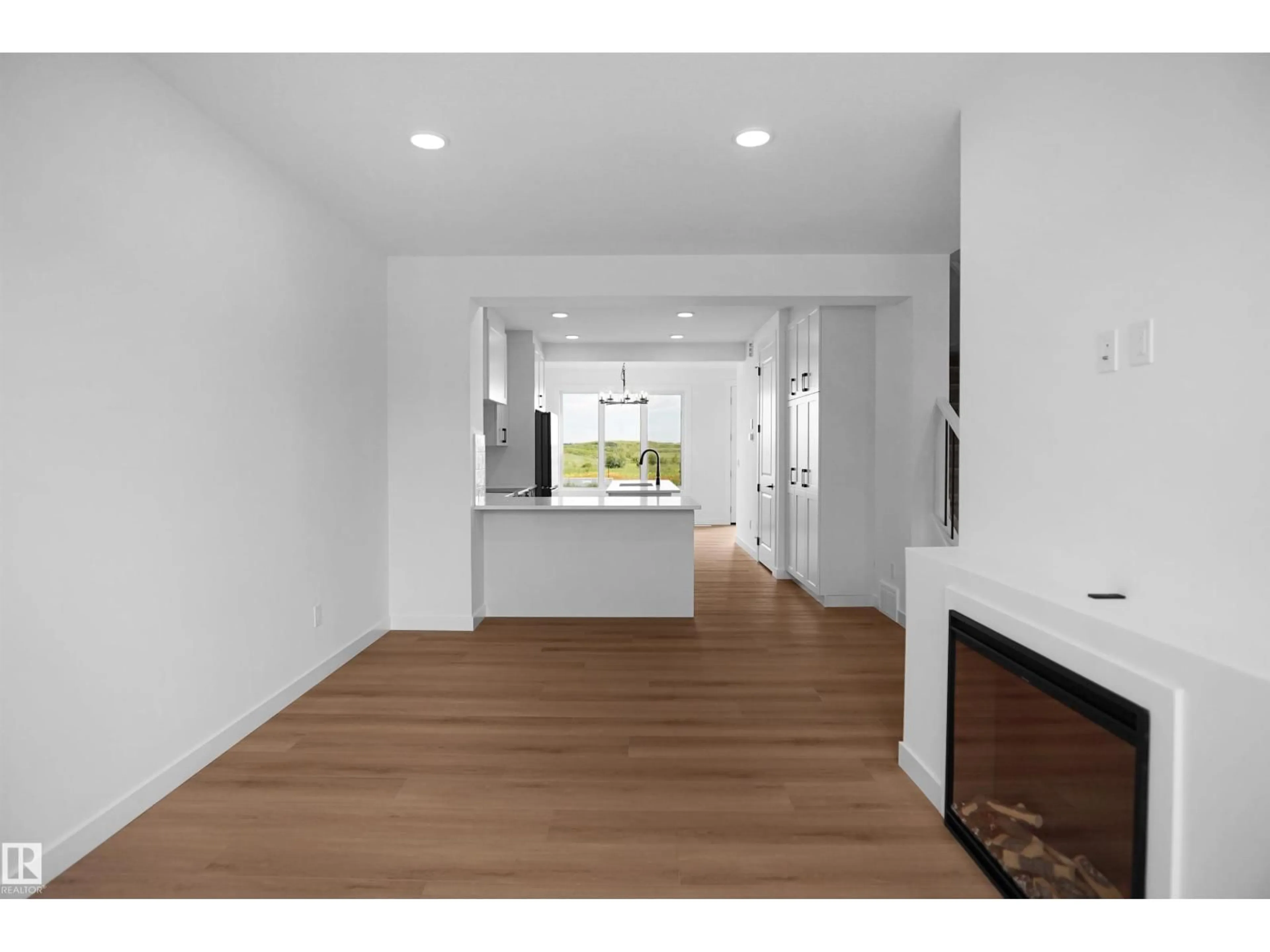 Open concept kitchen, wood/laminate floor for 73 SIENNA BV, Fort Saskatchewan Alberta T8L0Z1