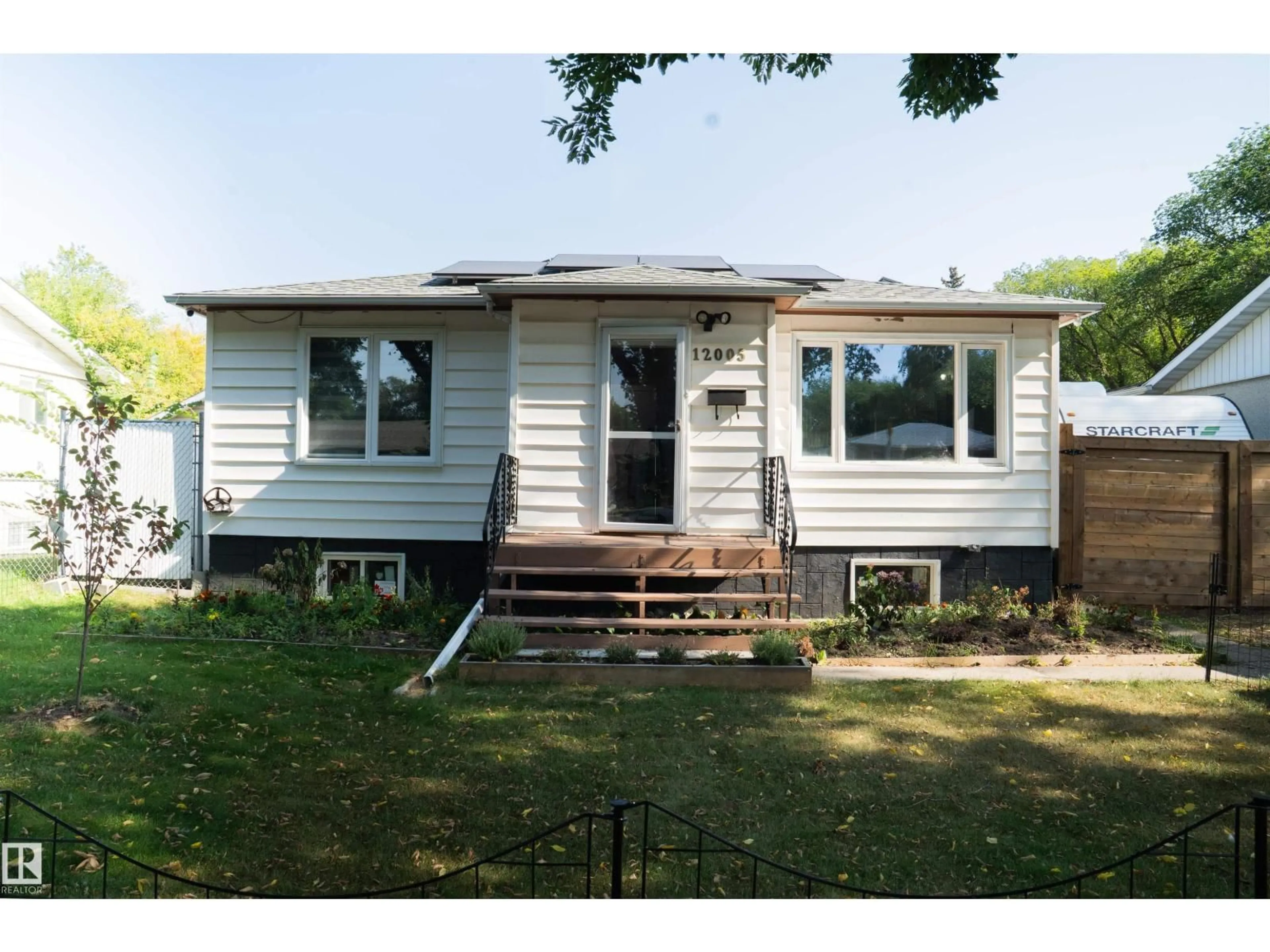 Home with vinyl exterior material, street for NW - 12005 40 ST, Edmonton Alberta T5W2L2