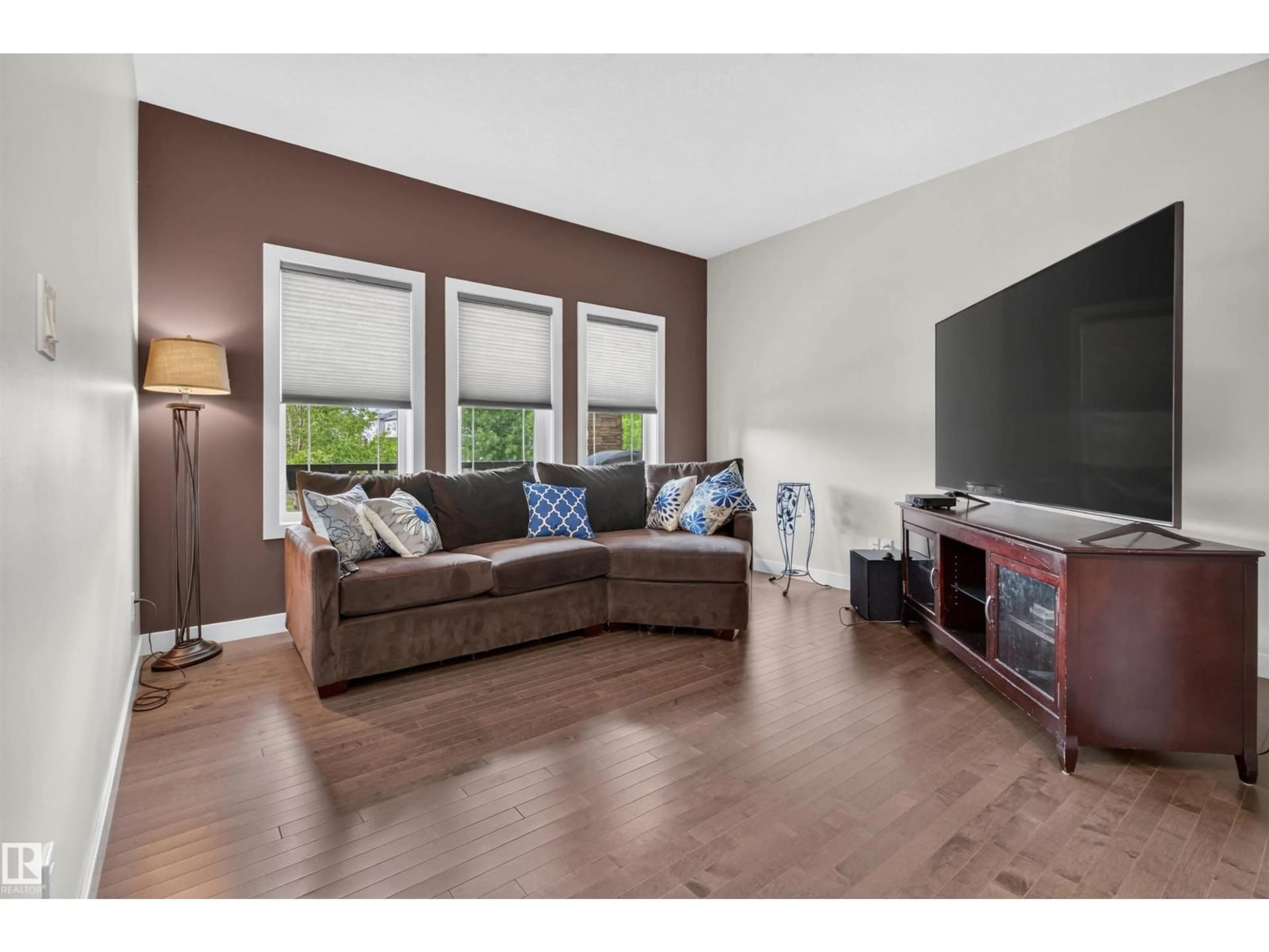 Living room with furniture, wood/laminate floor for 1541 SECORD RD, Edmonton Alberta T5T7B4