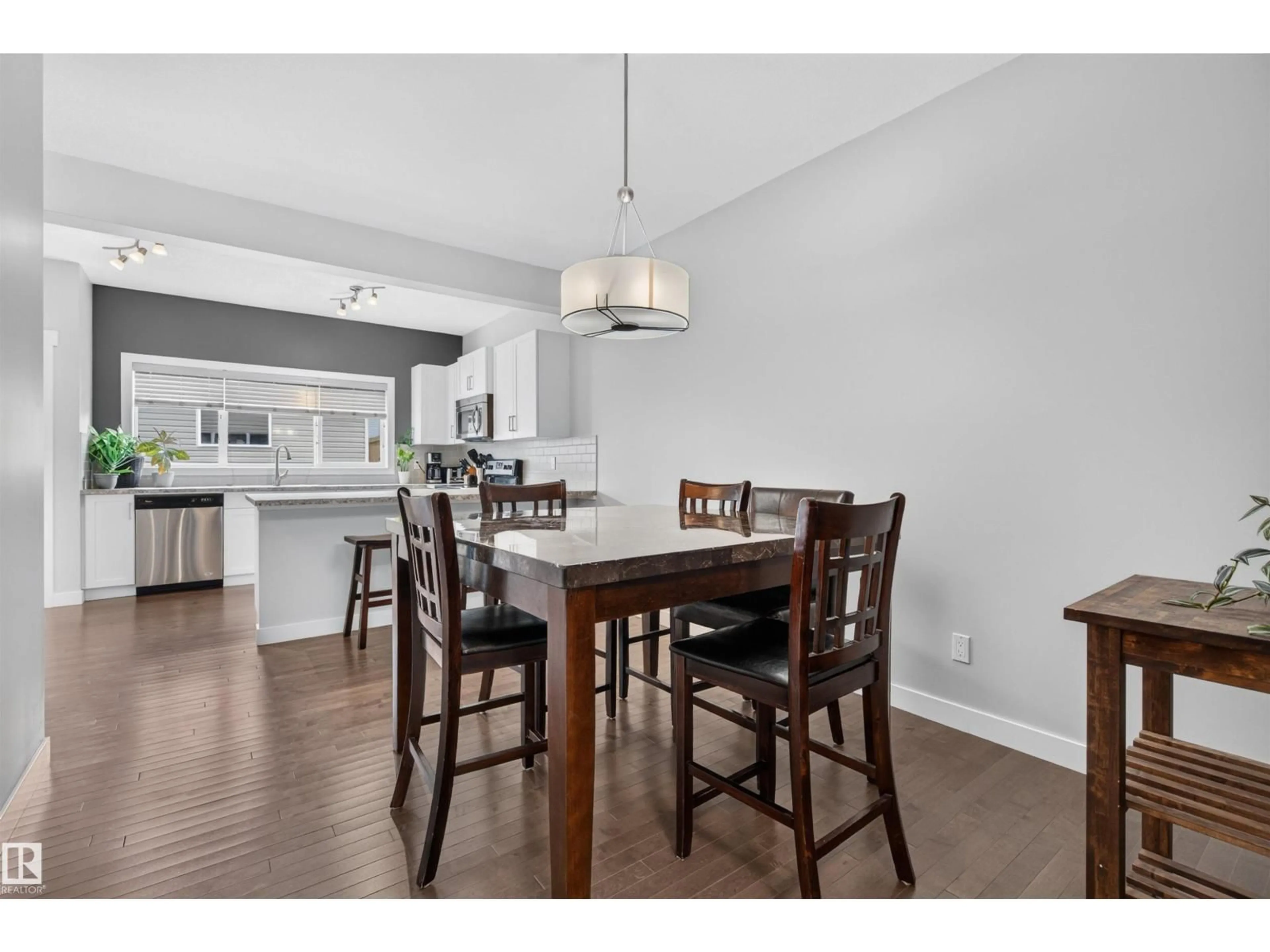Open concept kitchen, wood/laminate floor for 1541 SECORD RD, Edmonton Alberta T5T7B4