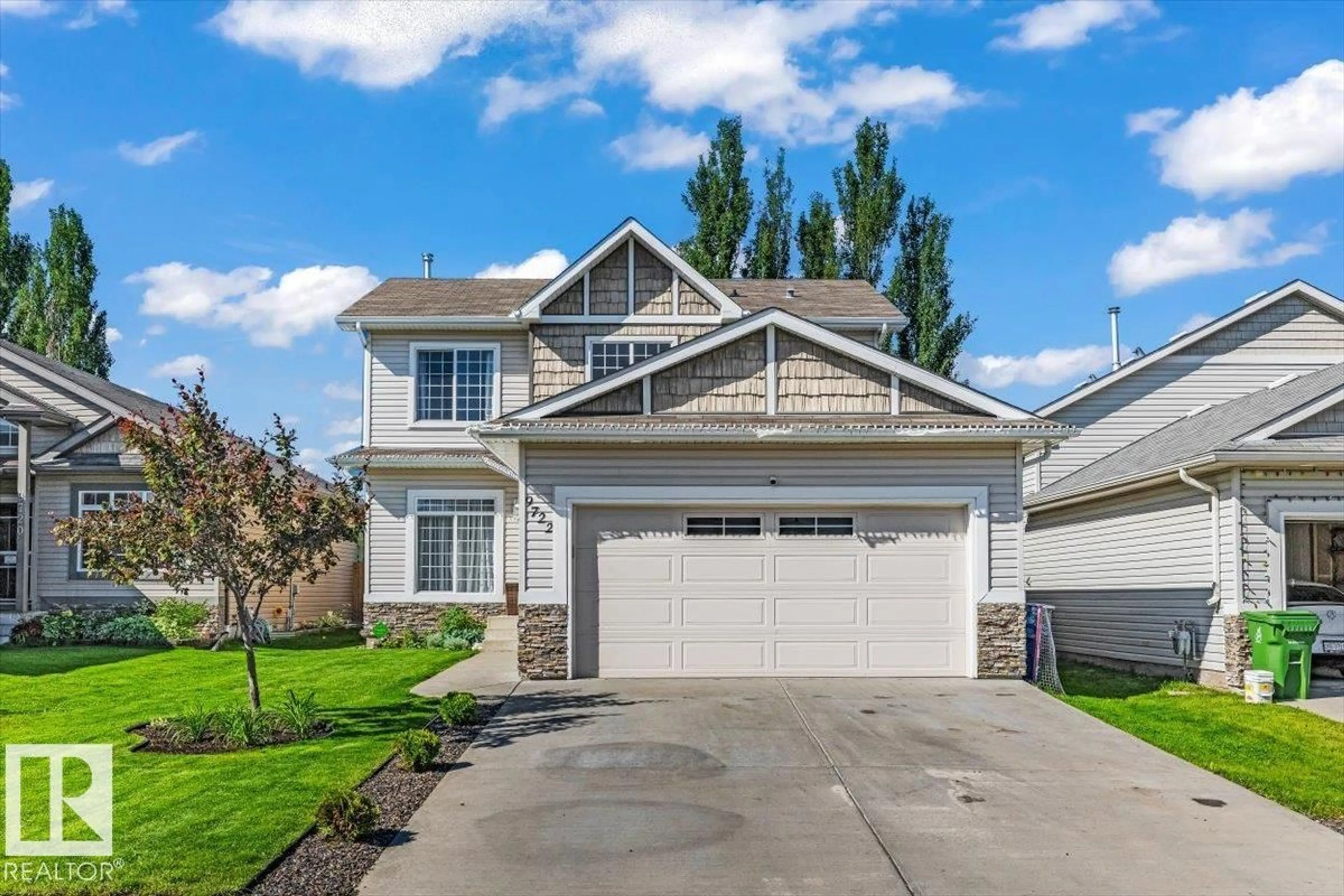 Home with vinyl exterior material, street for 9722 87 ST, Morinville Alberta T8R1V2
