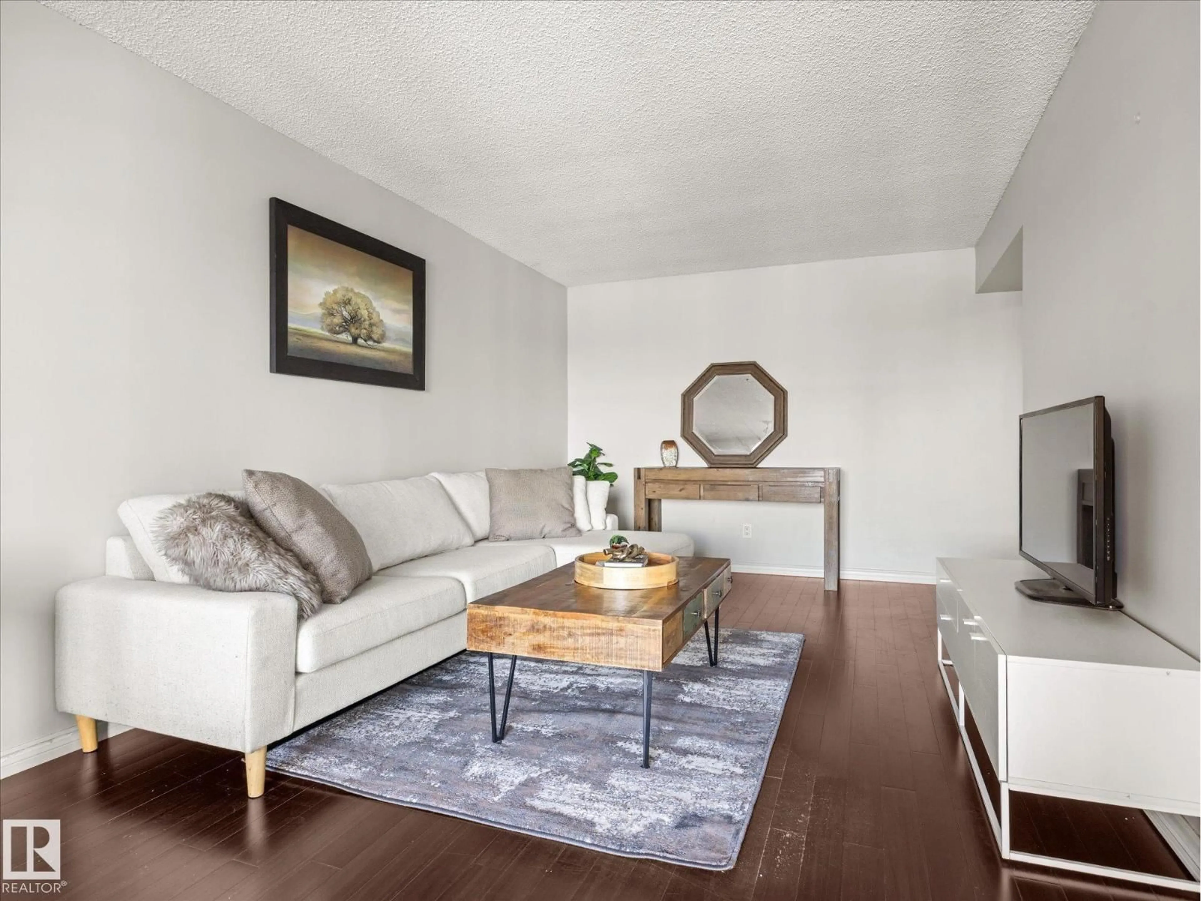 Living room with furniture, wood/laminate floor for #1601 - 9725 106 ST, Edmonton Alberta T5K1B5