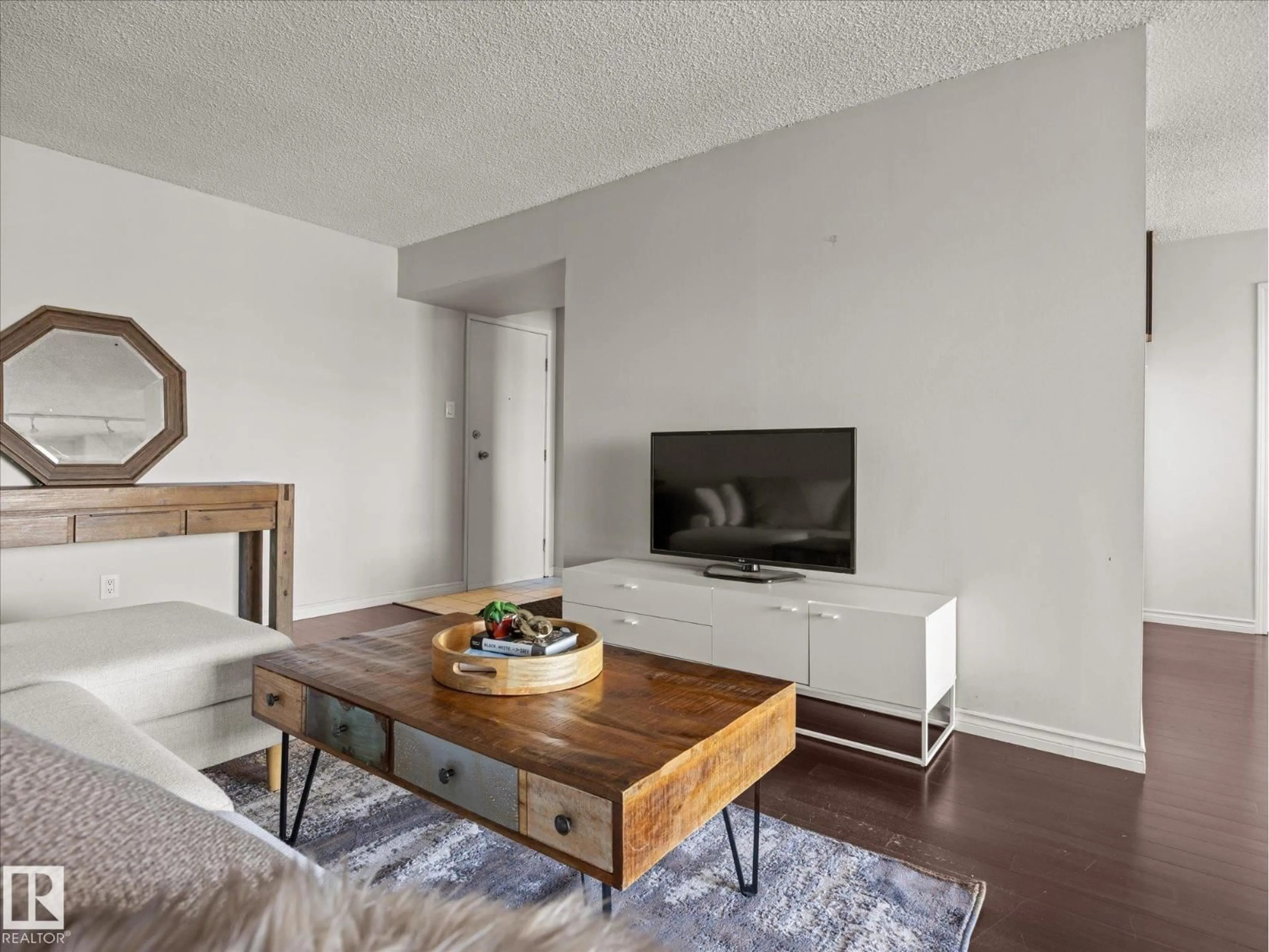 Living room with furniture, wood/laminate floor for #1601 - 9725 106 ST, Edmonton Alberta T5K1B5