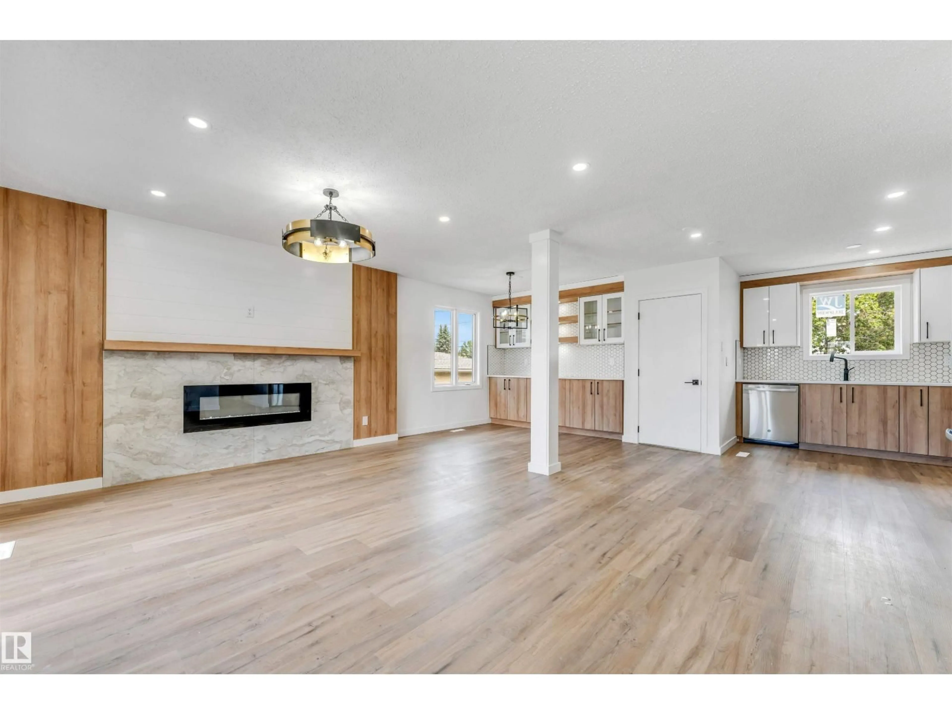 Open concept kitchen, wood/laminate floor for 6404 88 AV, Edmonton Alberta T6B0M2