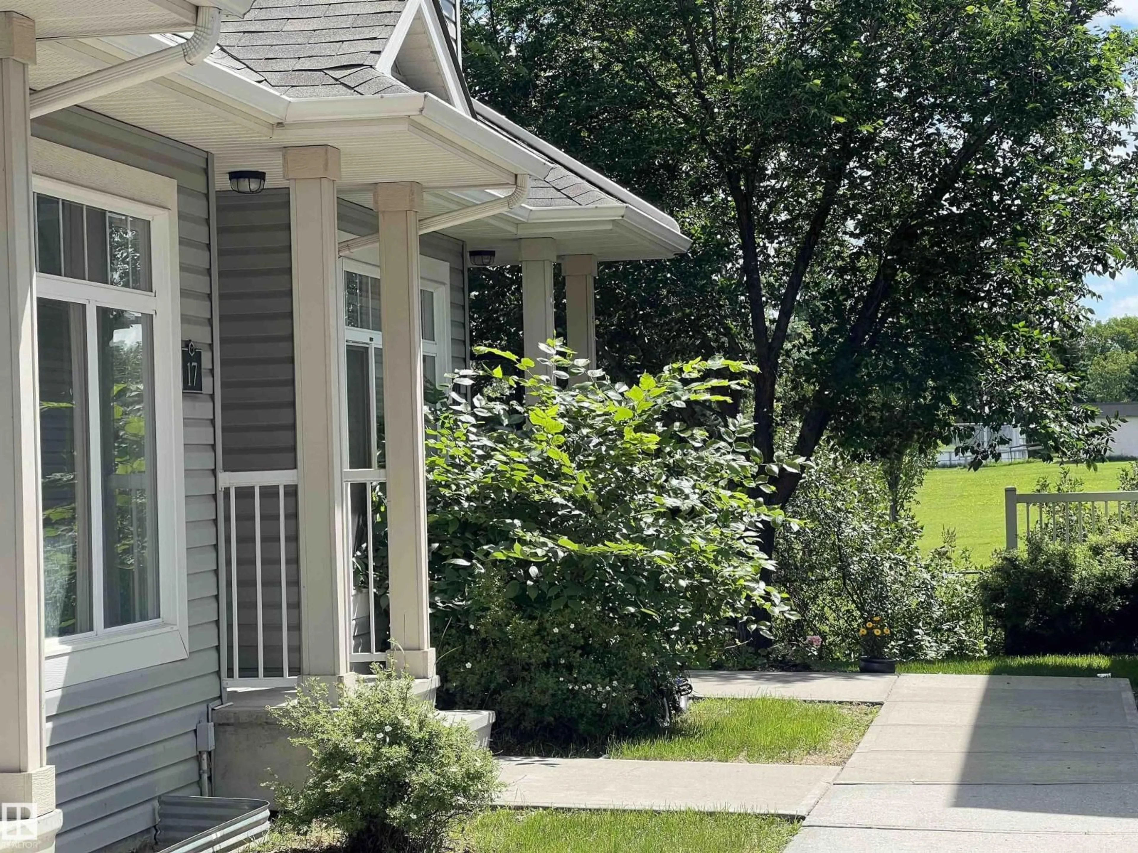 Home with vinyl exterior material, street for 18 - 6032 38 AV NW, Edmonton Alberta T6L0A4