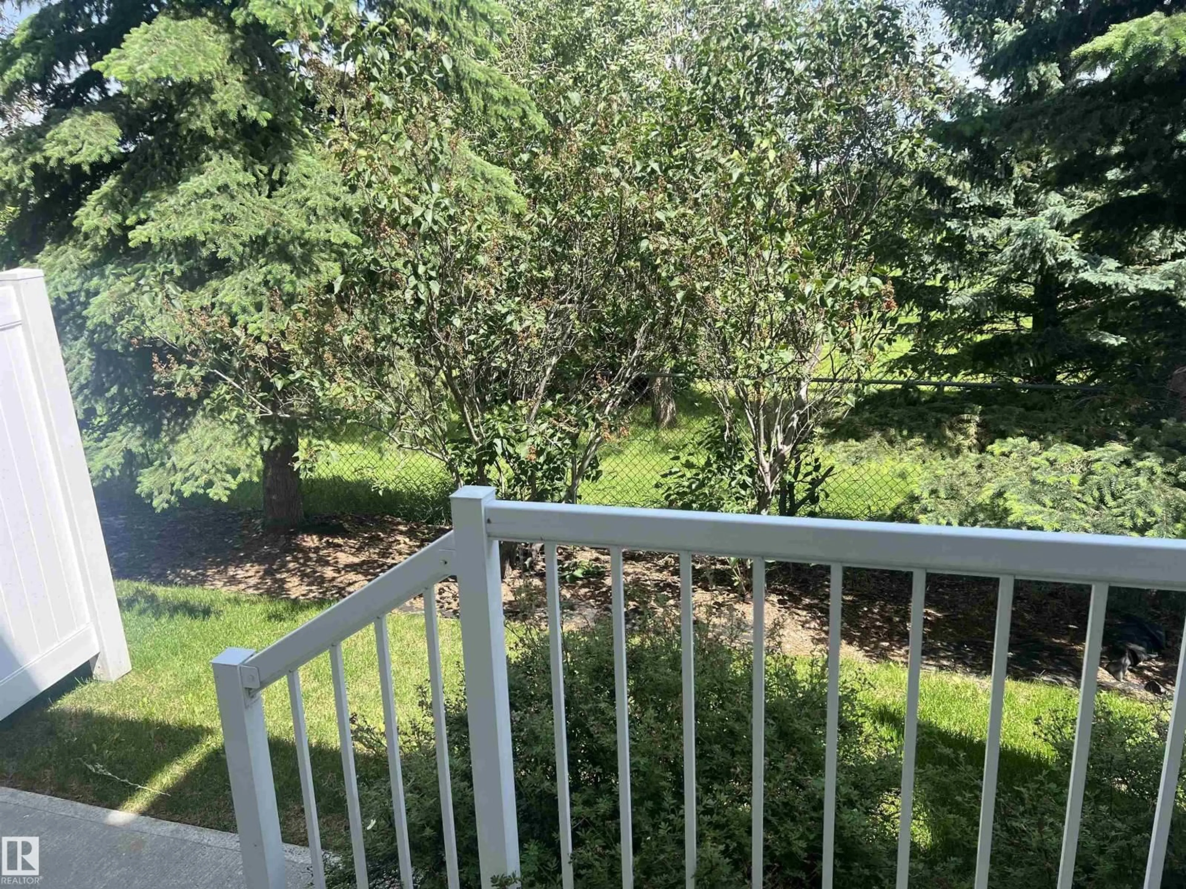 Patio, forest/trees view for 18 - 6032 38 AV NW, Edmonton Alberta T6L0A4