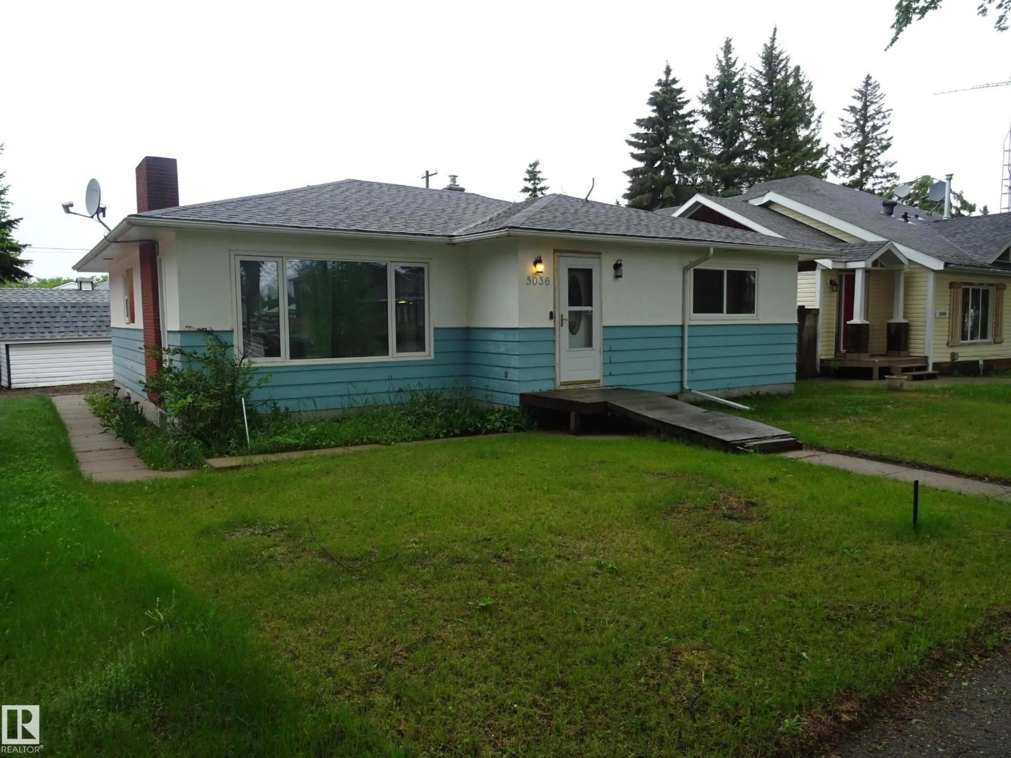Home with vinyl exterior material, street for 5036 52 ST, Andrew Alberta T0B0C0