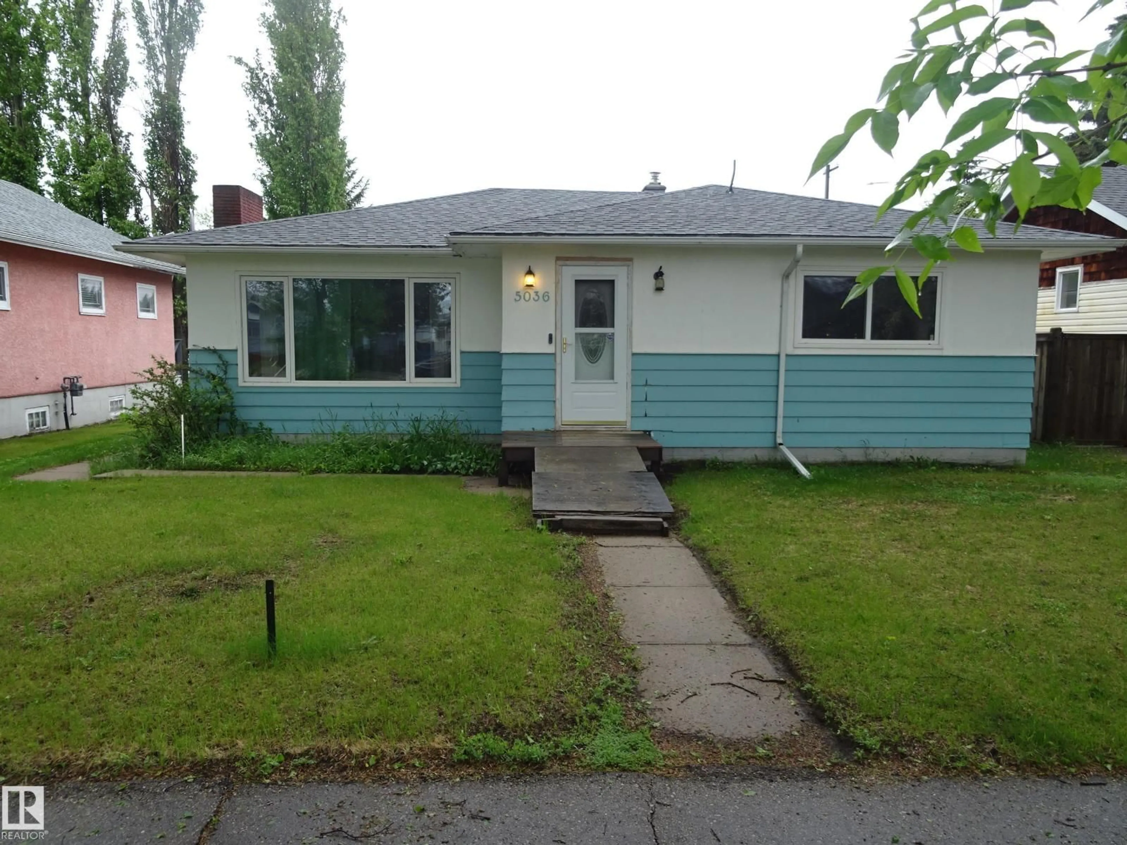 Home with vinyl exterior material, street for 5036 52 ST, Andrew Alberta T0B0C0