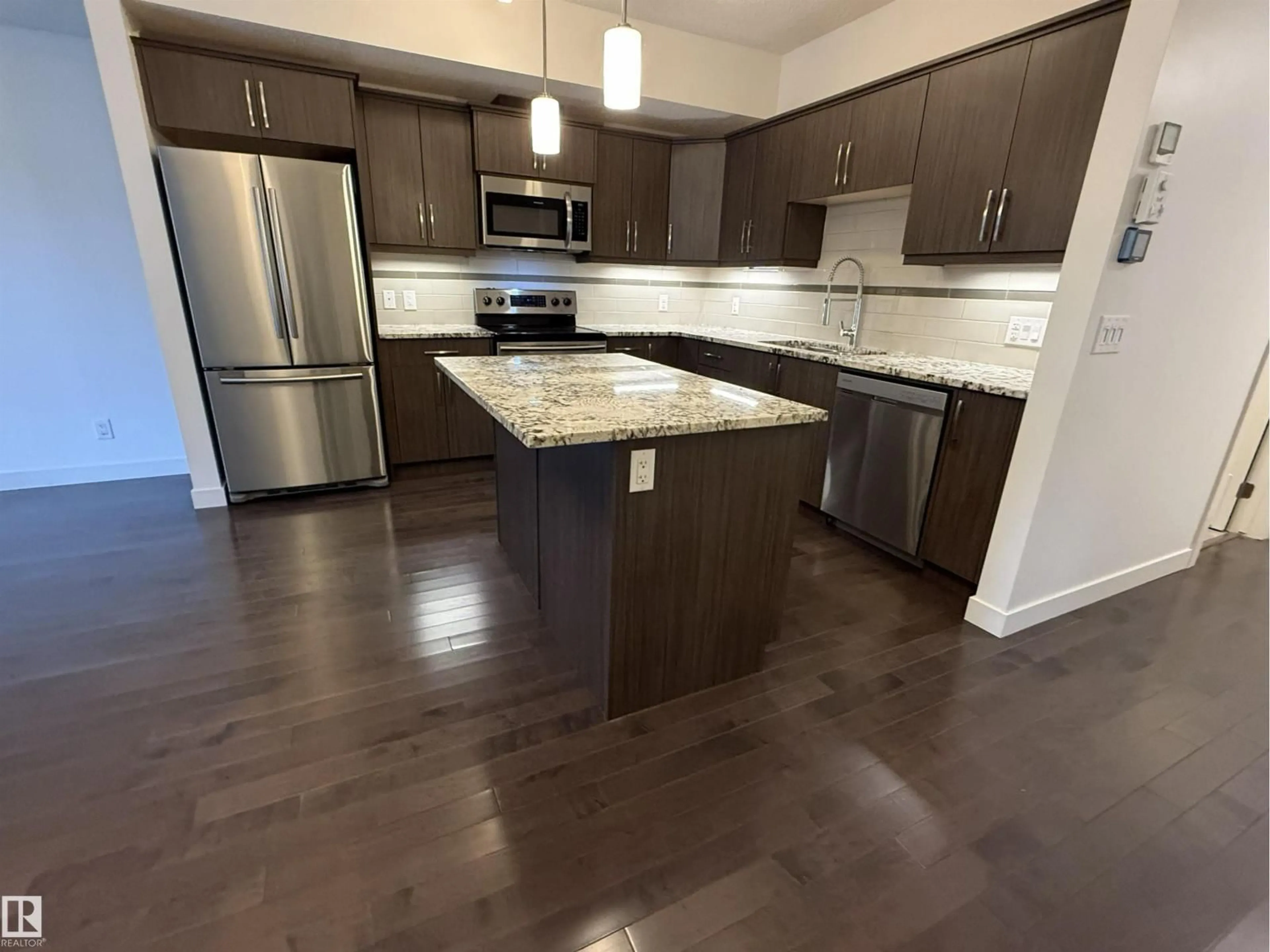 Open concept kitchen, unknown for #119 - 10523 123 ST, Edmonton Alberta T5N1N9